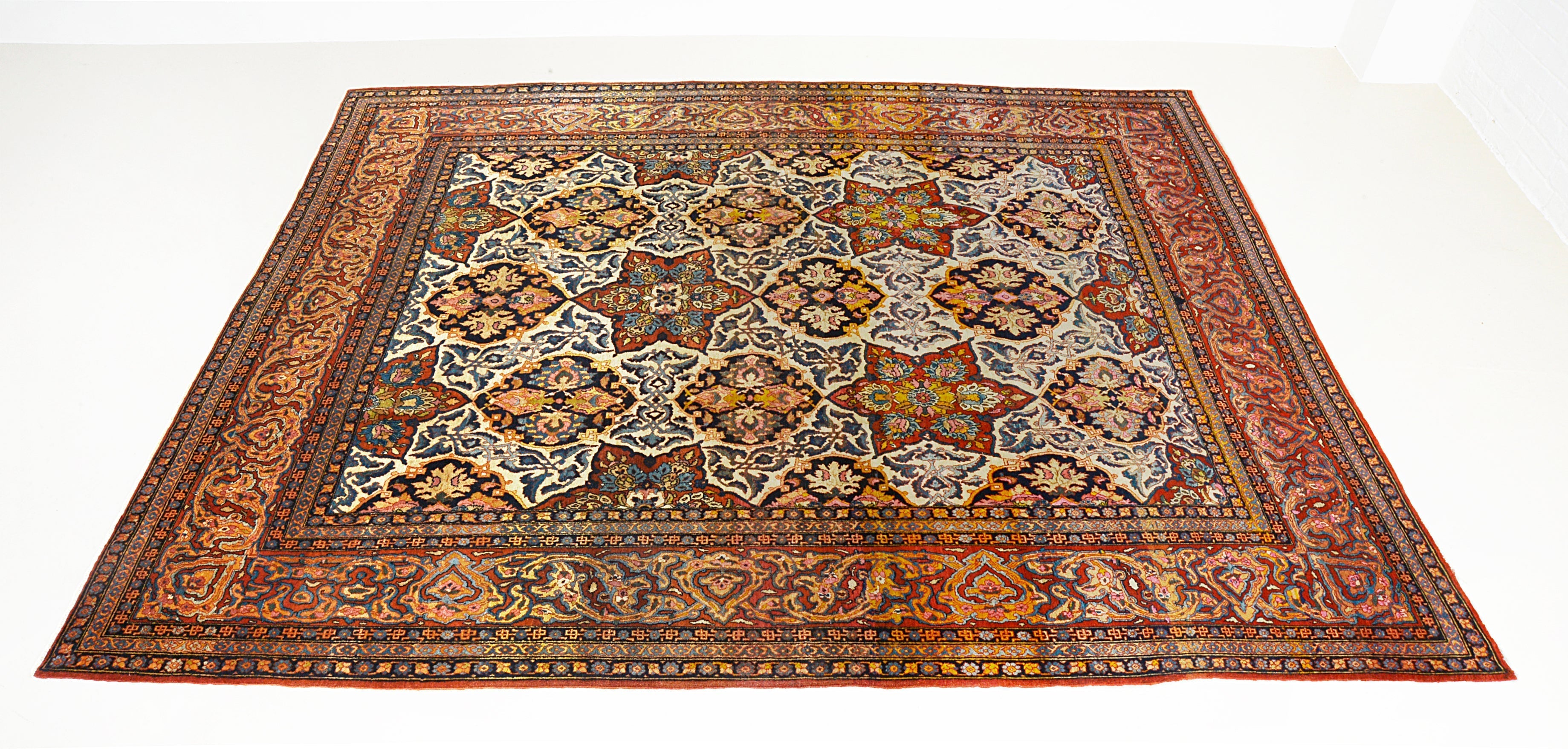 Antique Persian Isfahan Carpet for sale at Hakiemie Rug Gallery, hand-knotted wool rug ideal for Mayfair homes and luxury London interiors UK
