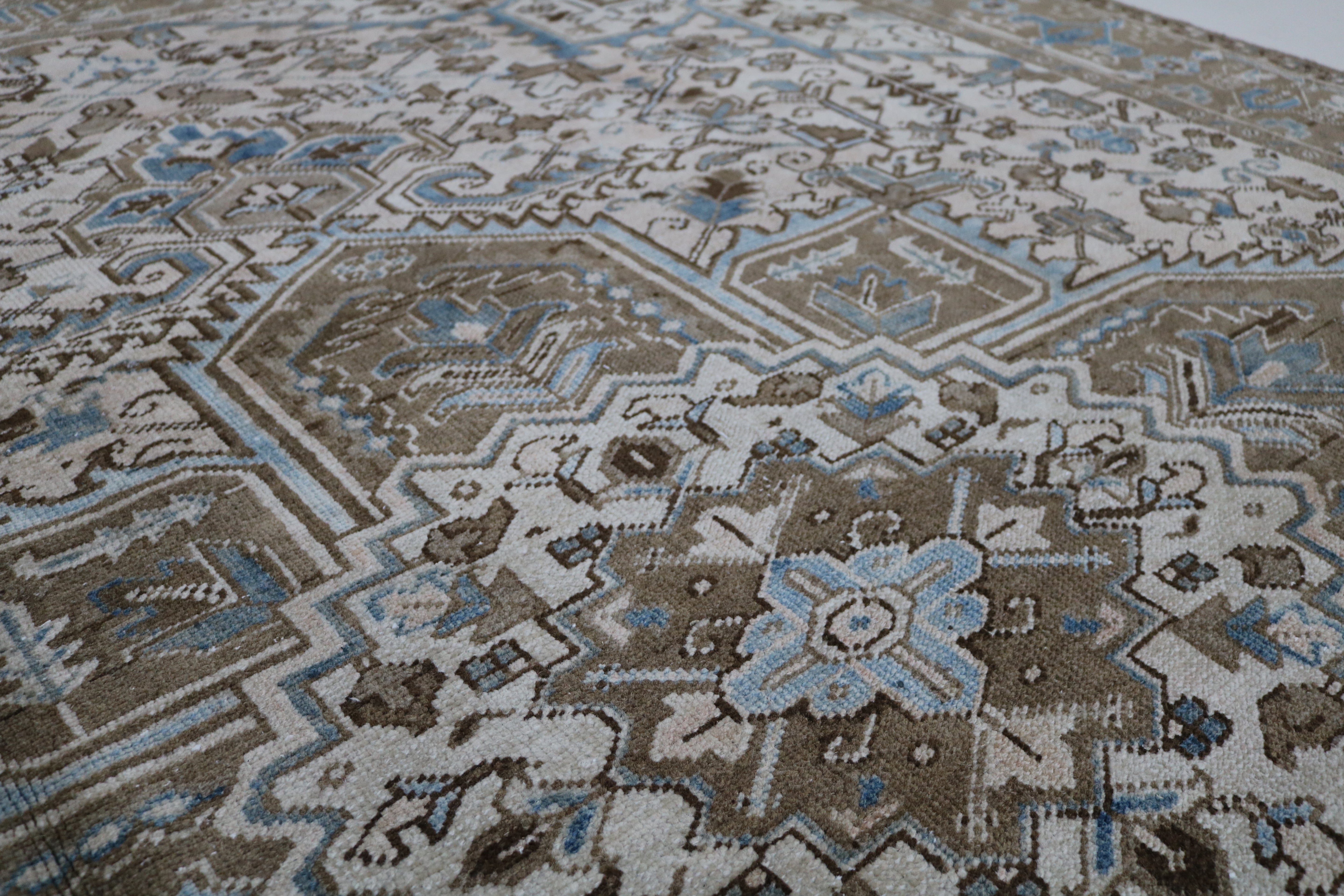 Close-up of hand-knotted wool texture on decorative antique Heriz carpet