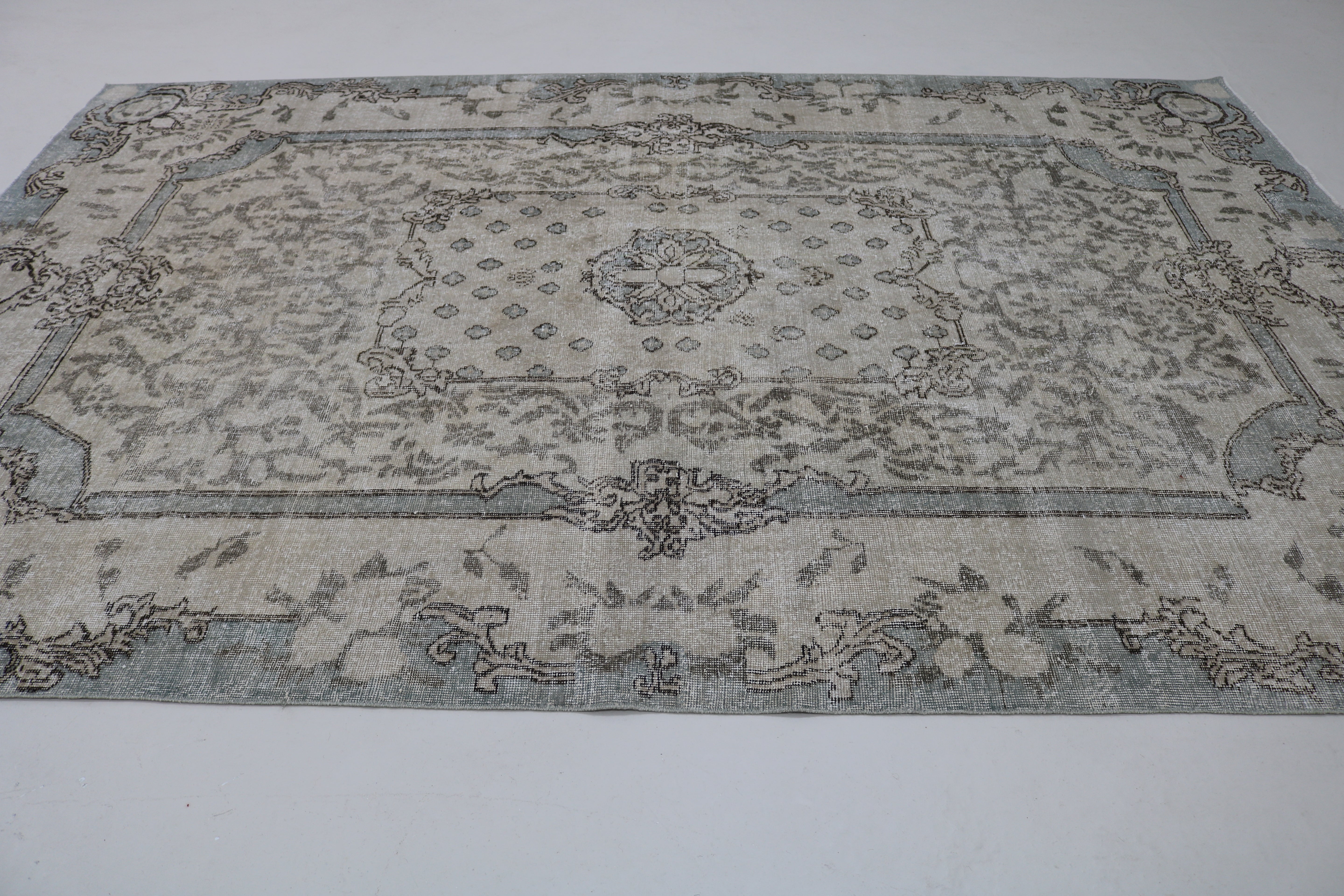 Perspective view of vintage Turkish Sparta rug on floor