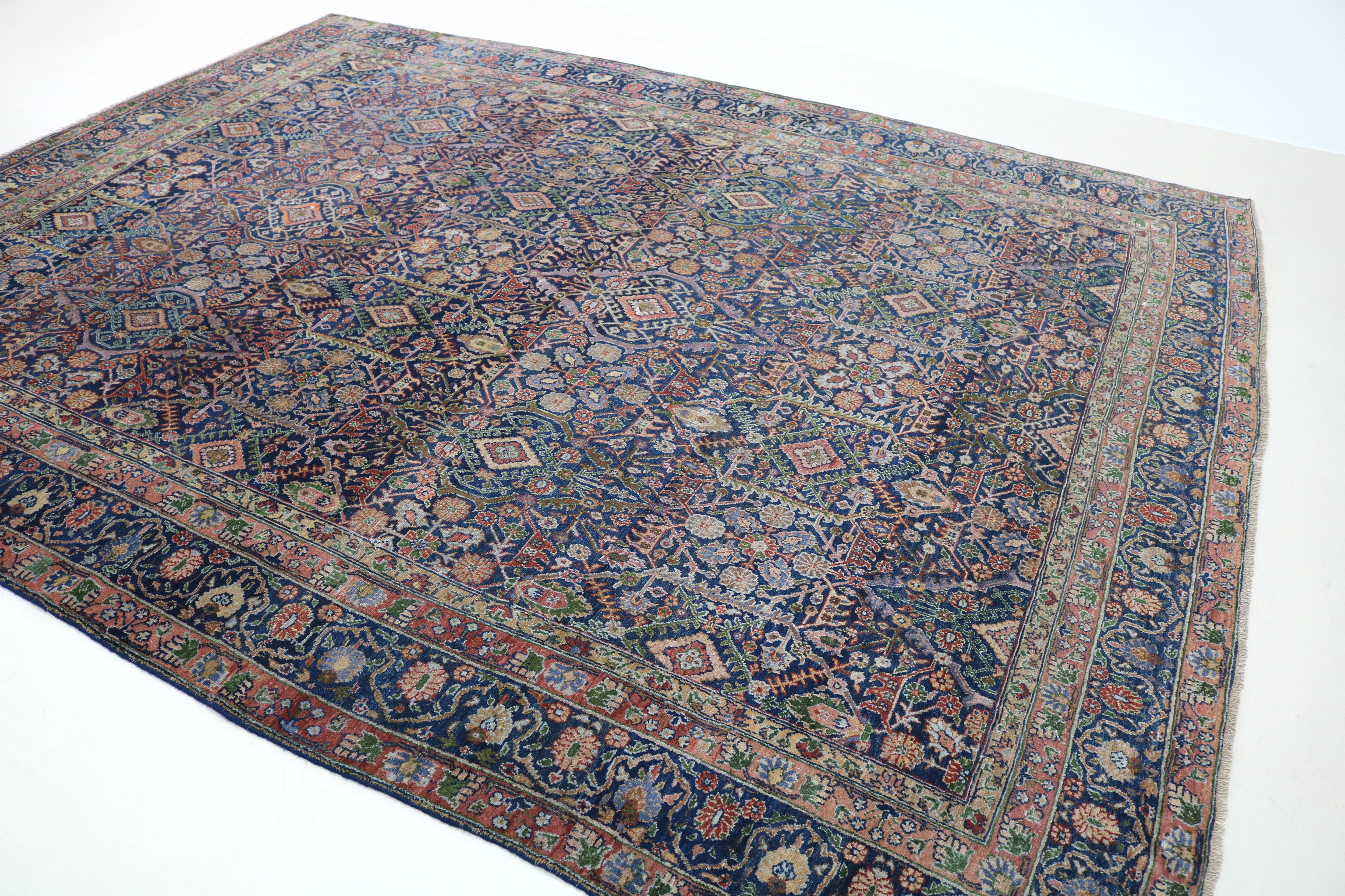Close-up of finely woven wool texture on antique Persian Senneh carpet