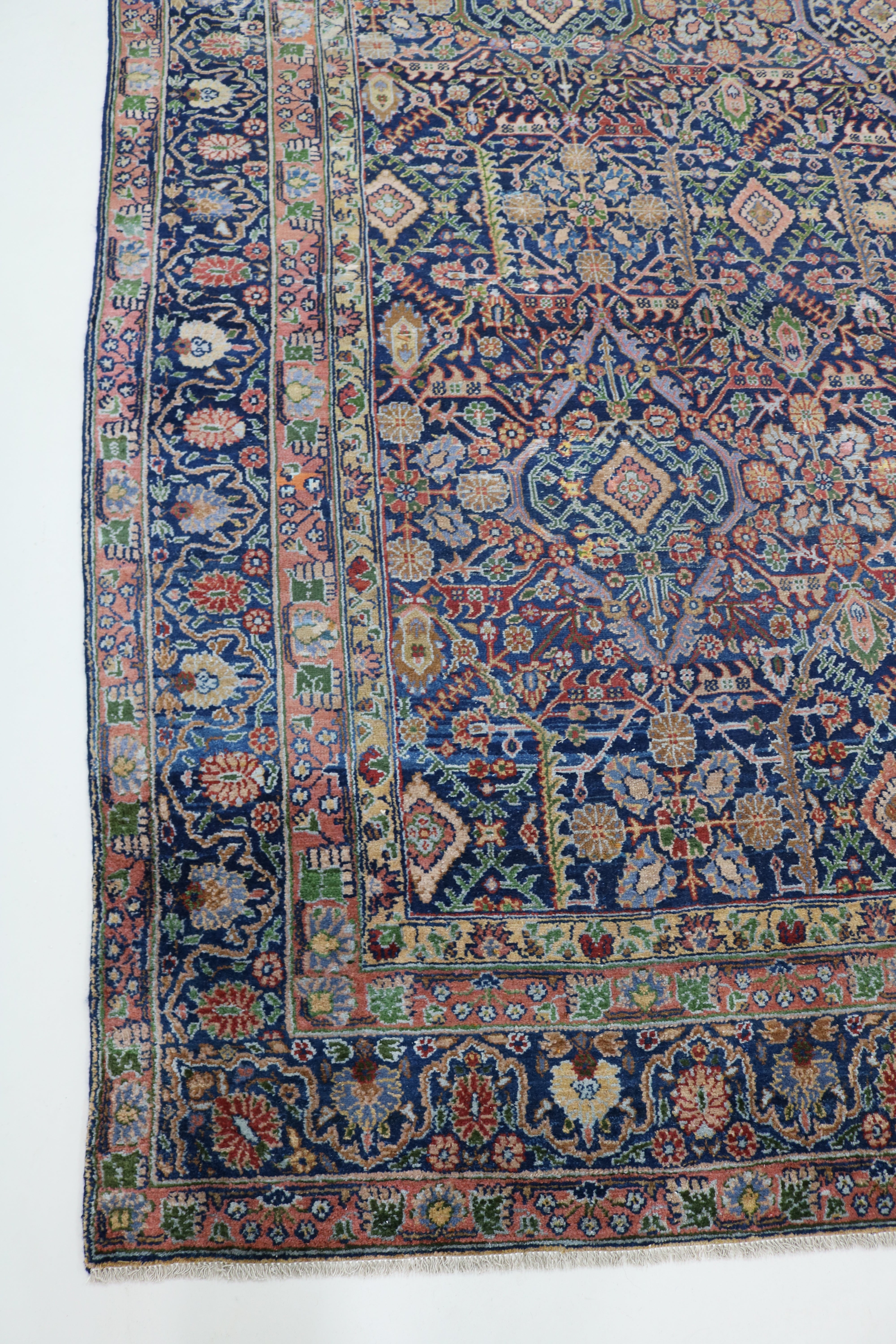 Antique Persian Senneh carpet with finely drawn floral lattice and rich polychrome field, 320 × 268 cm