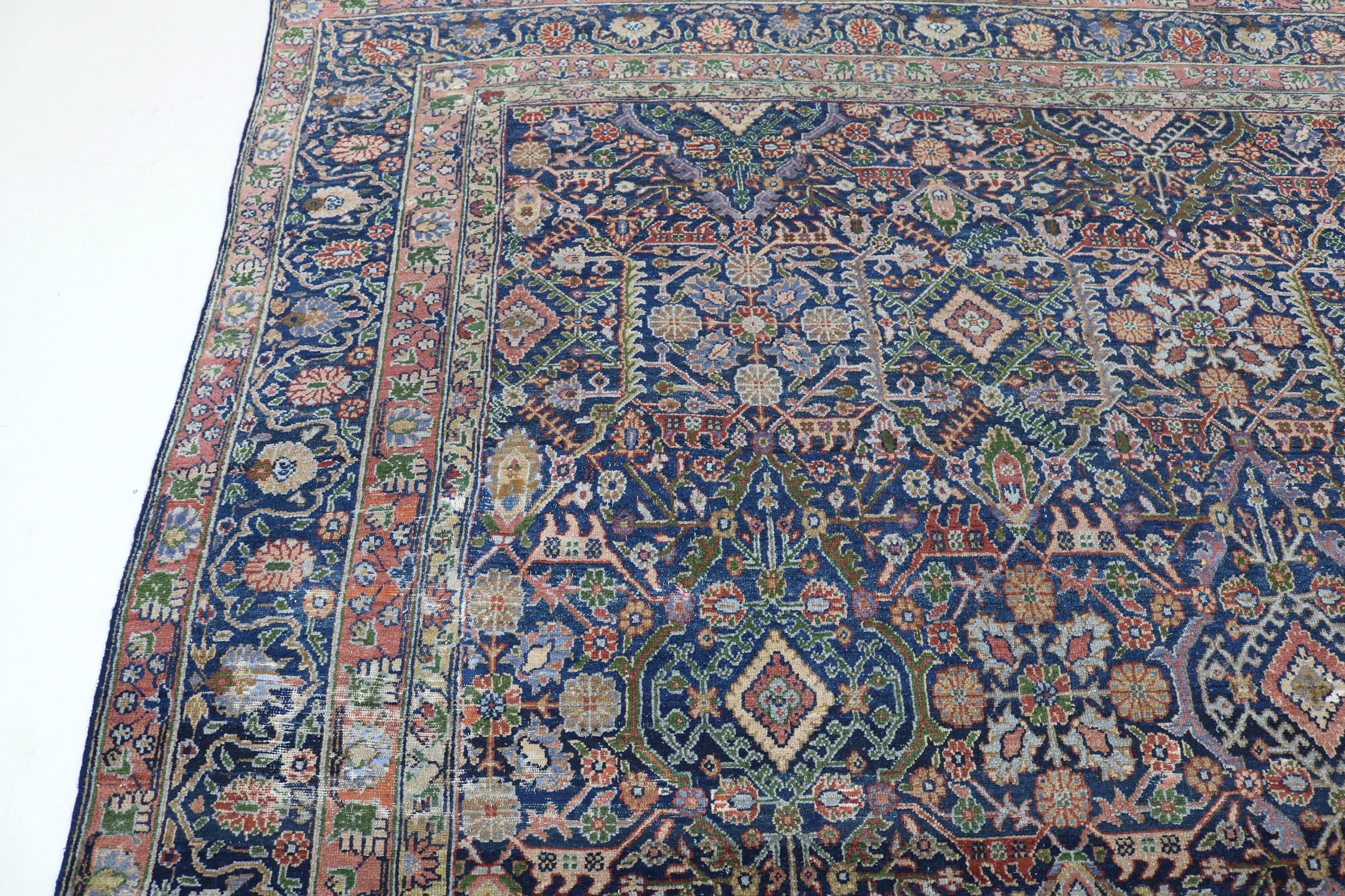 Close-up of finely woven wool texture on antique Persian Senneh carpet