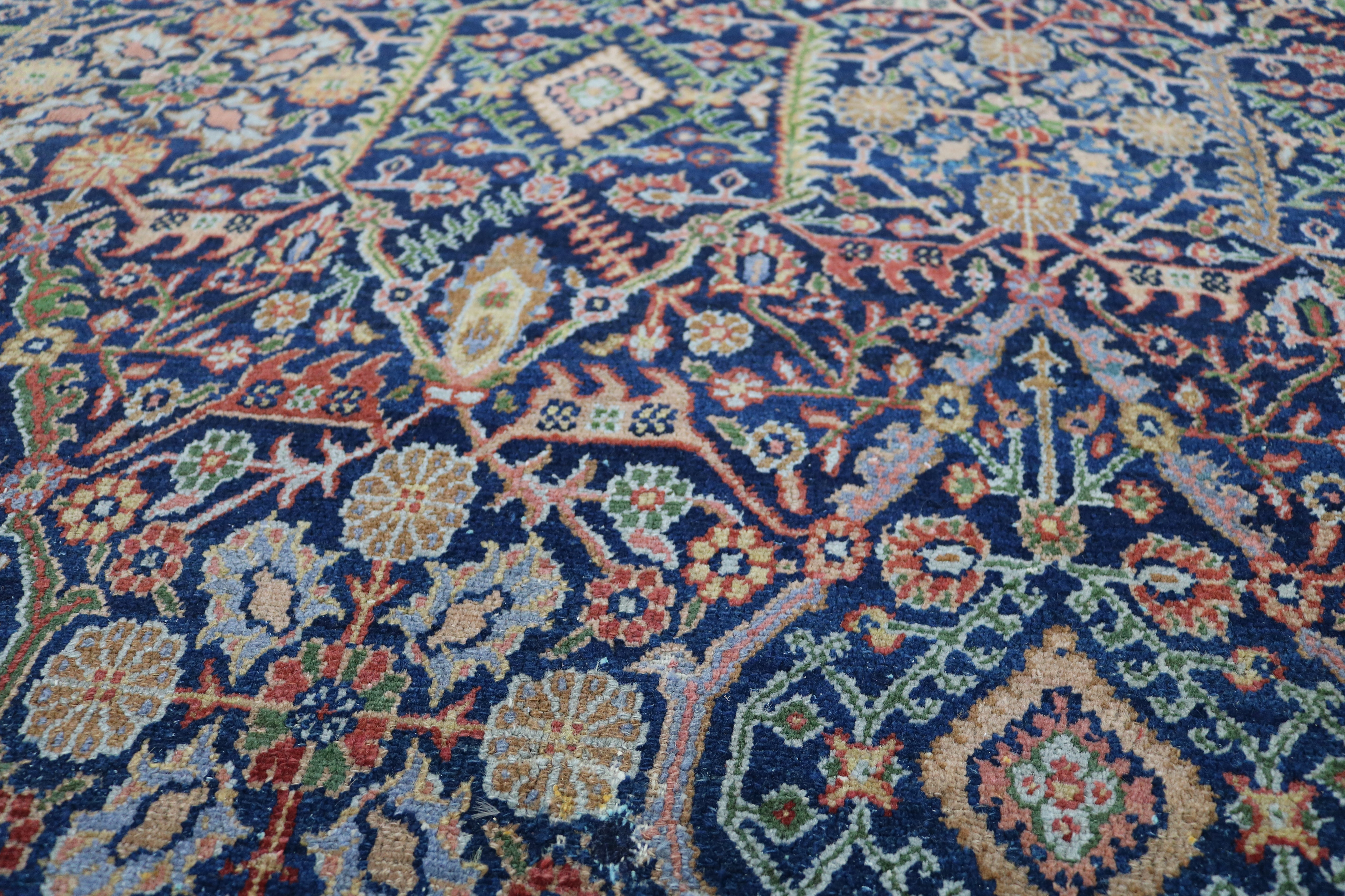 Close-up of finely woven wool texture on antique Persian Senneh carpet