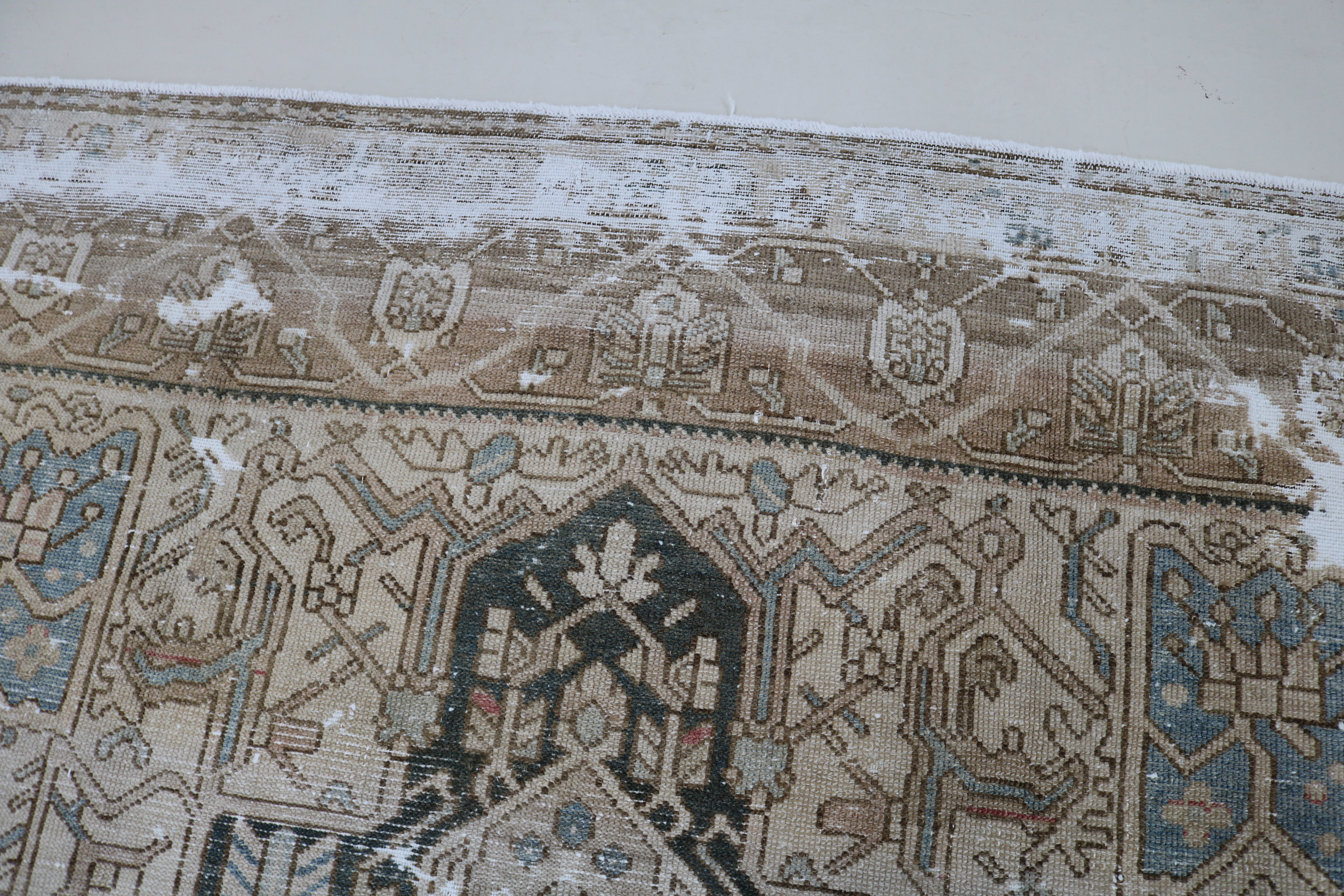Close-up of hand-knotted wool texture on antique Persian Karaja carpet