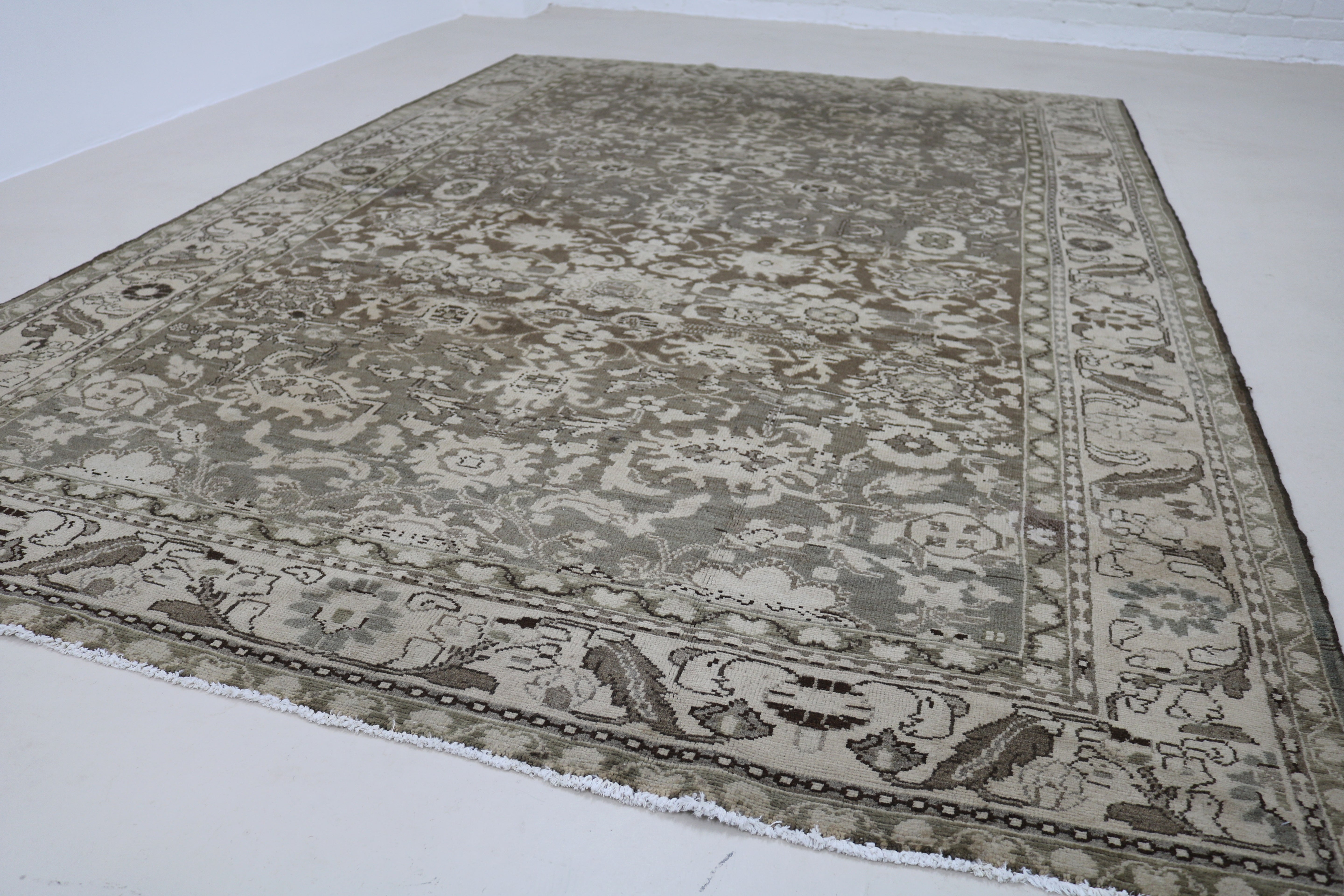 Angled view of Persian Malayer carpet showing overall design and proportions