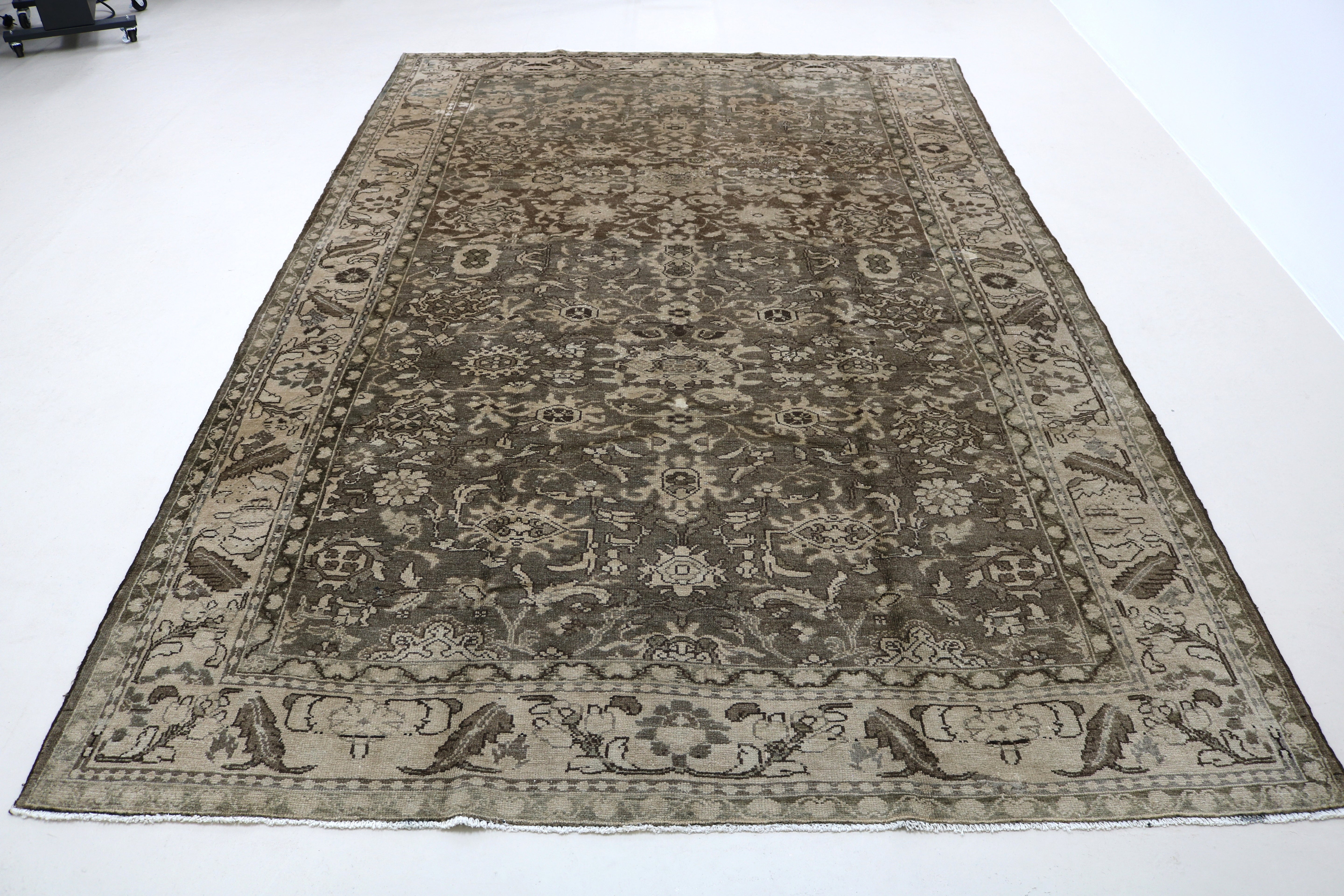 Perspective view of Persian Malayer carpet on floor