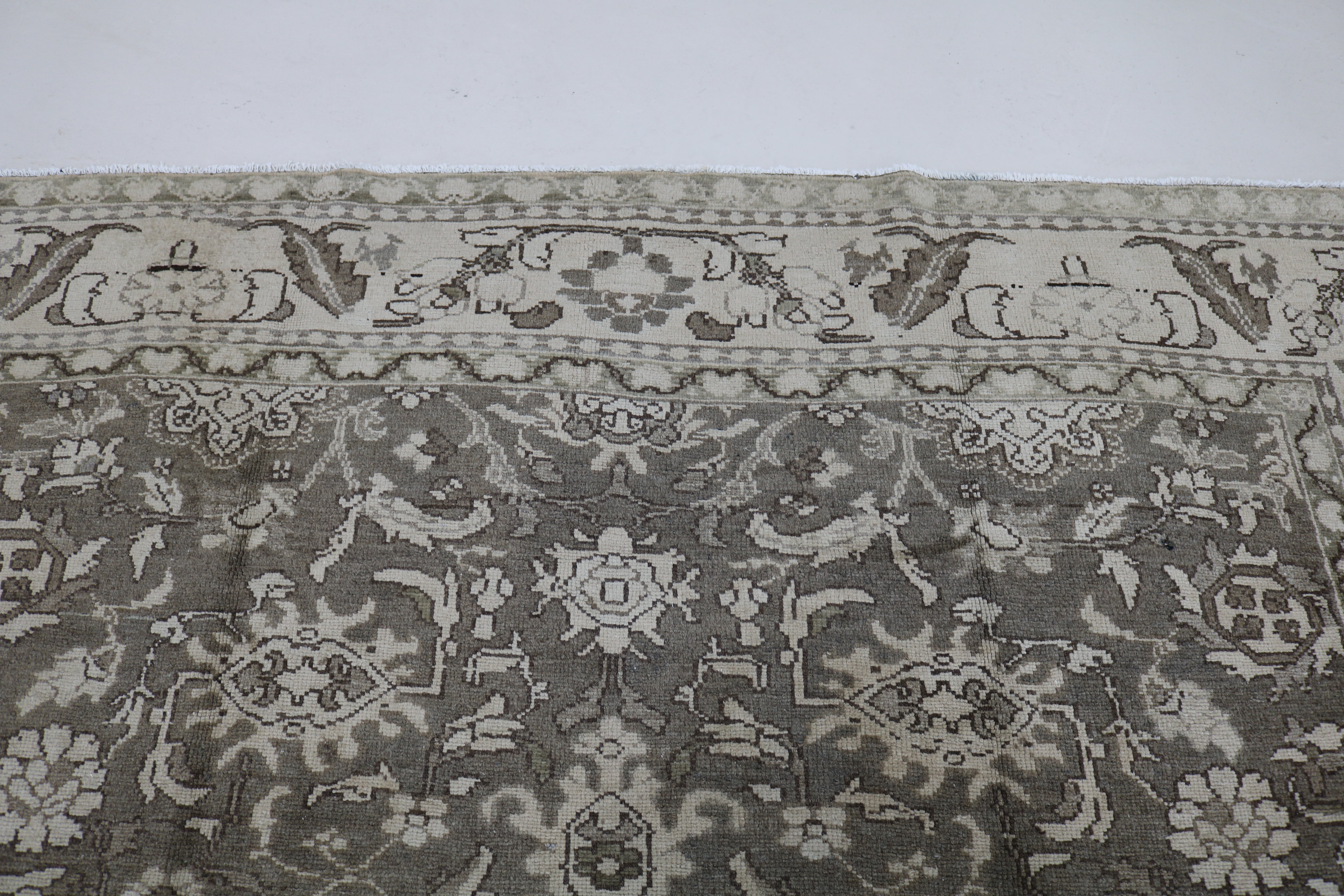 Close-up of hand-knotted wool texture on Persian Malayer carpet
