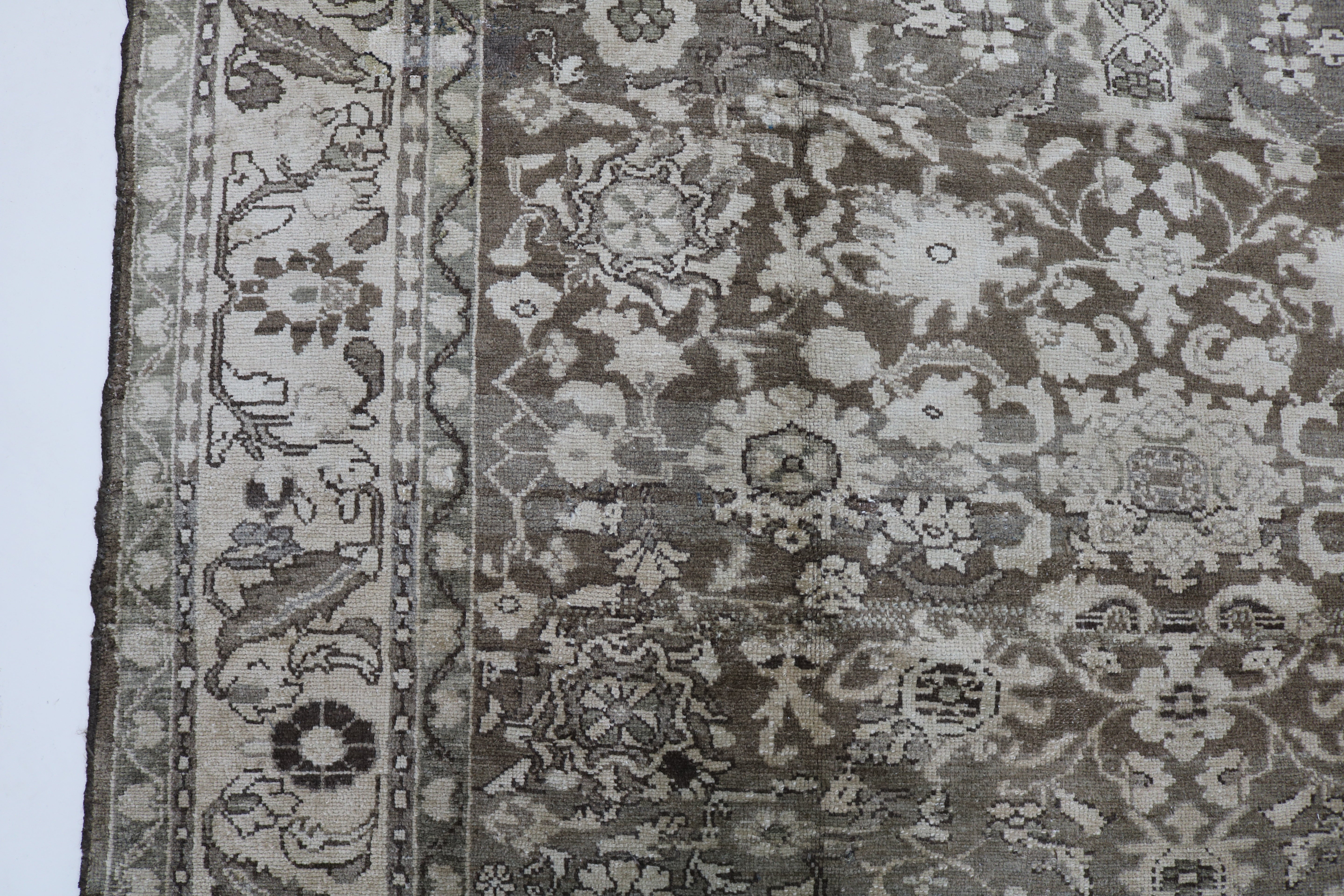 Close-up of hand-knotted wool texture on Persian Malayer carpet