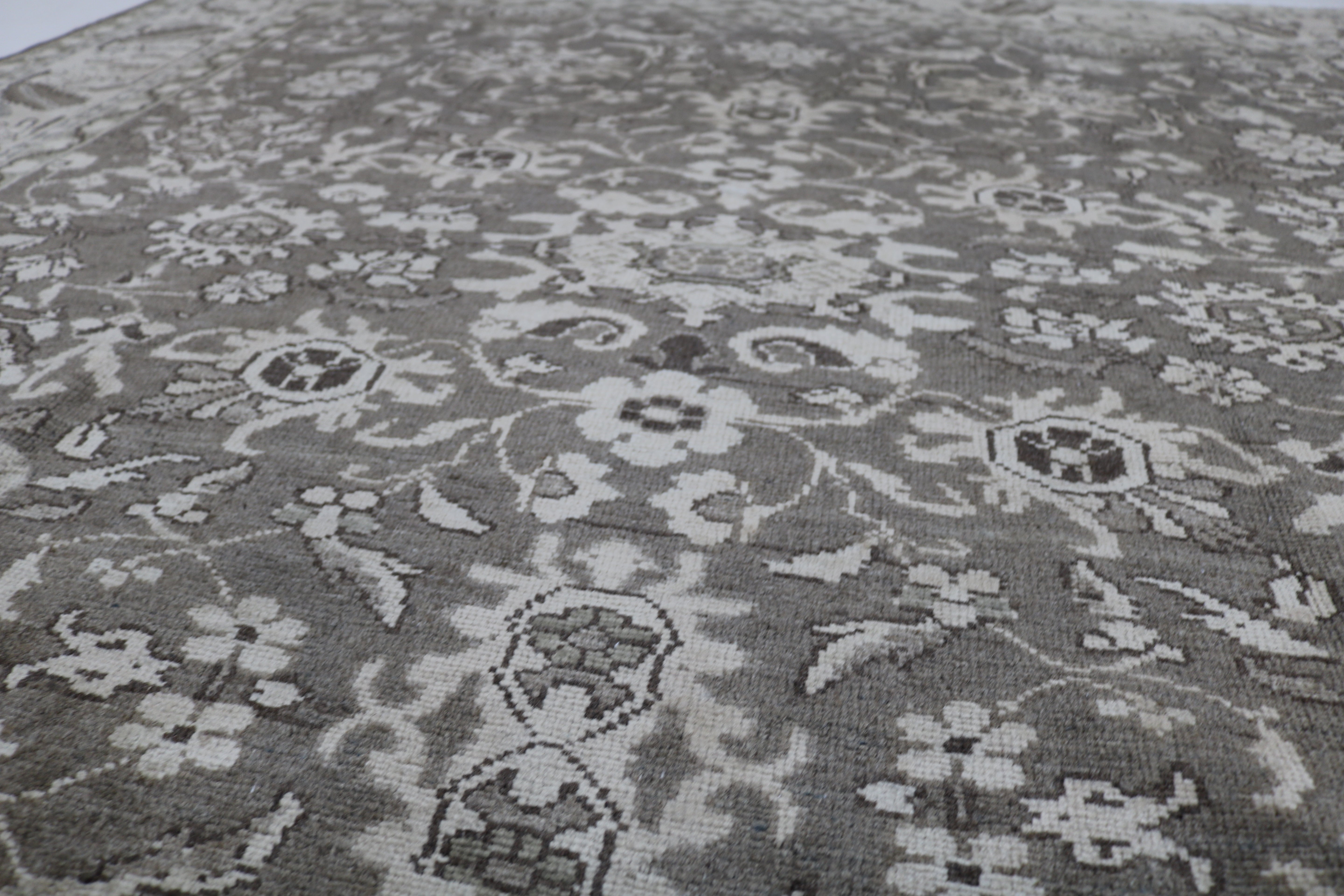 Close-up of hand-knotted wool texture on Persian Malayer carpet