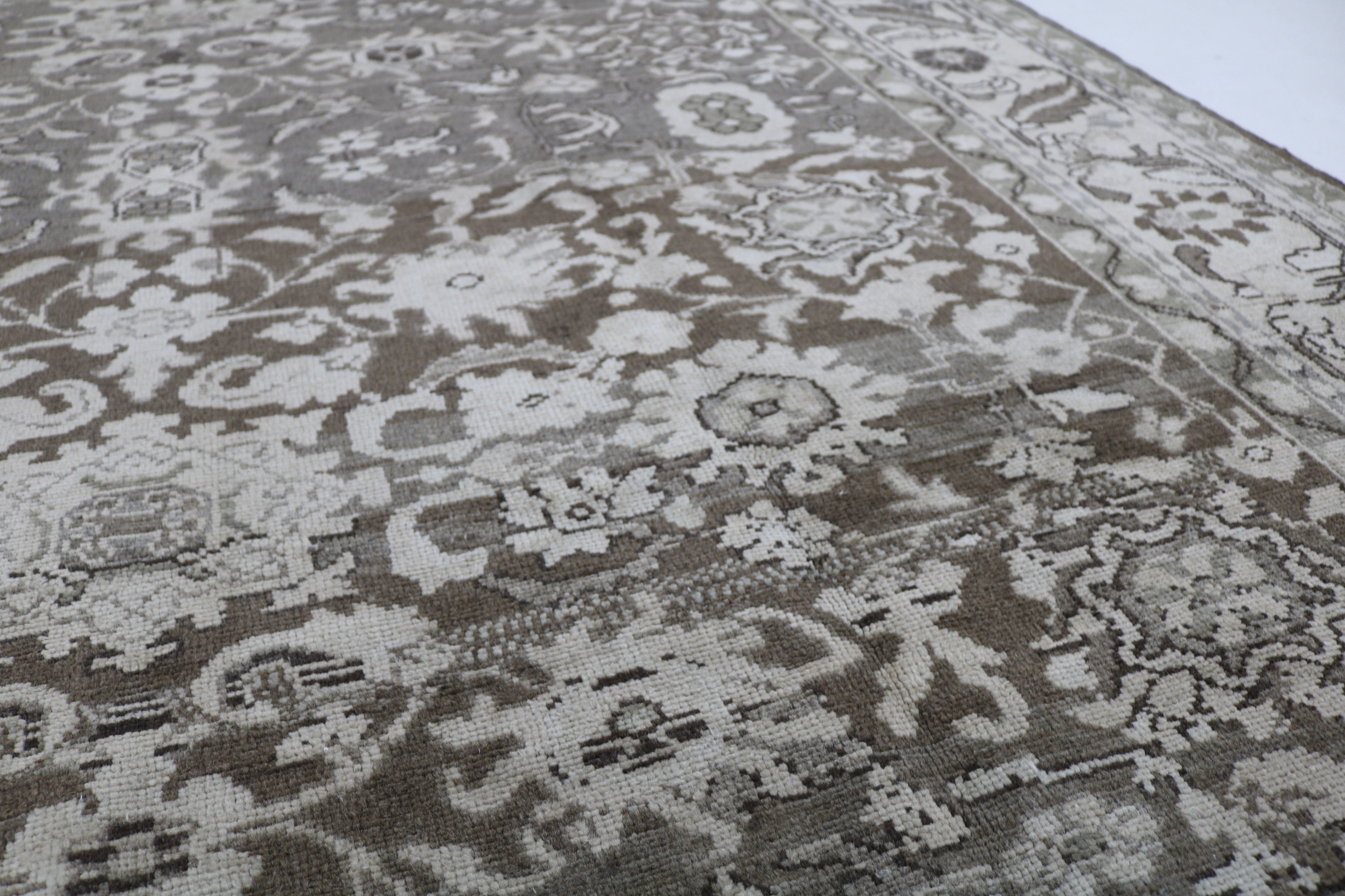Close-up of hand-knotted wool texture on Persian Malayer carpet
