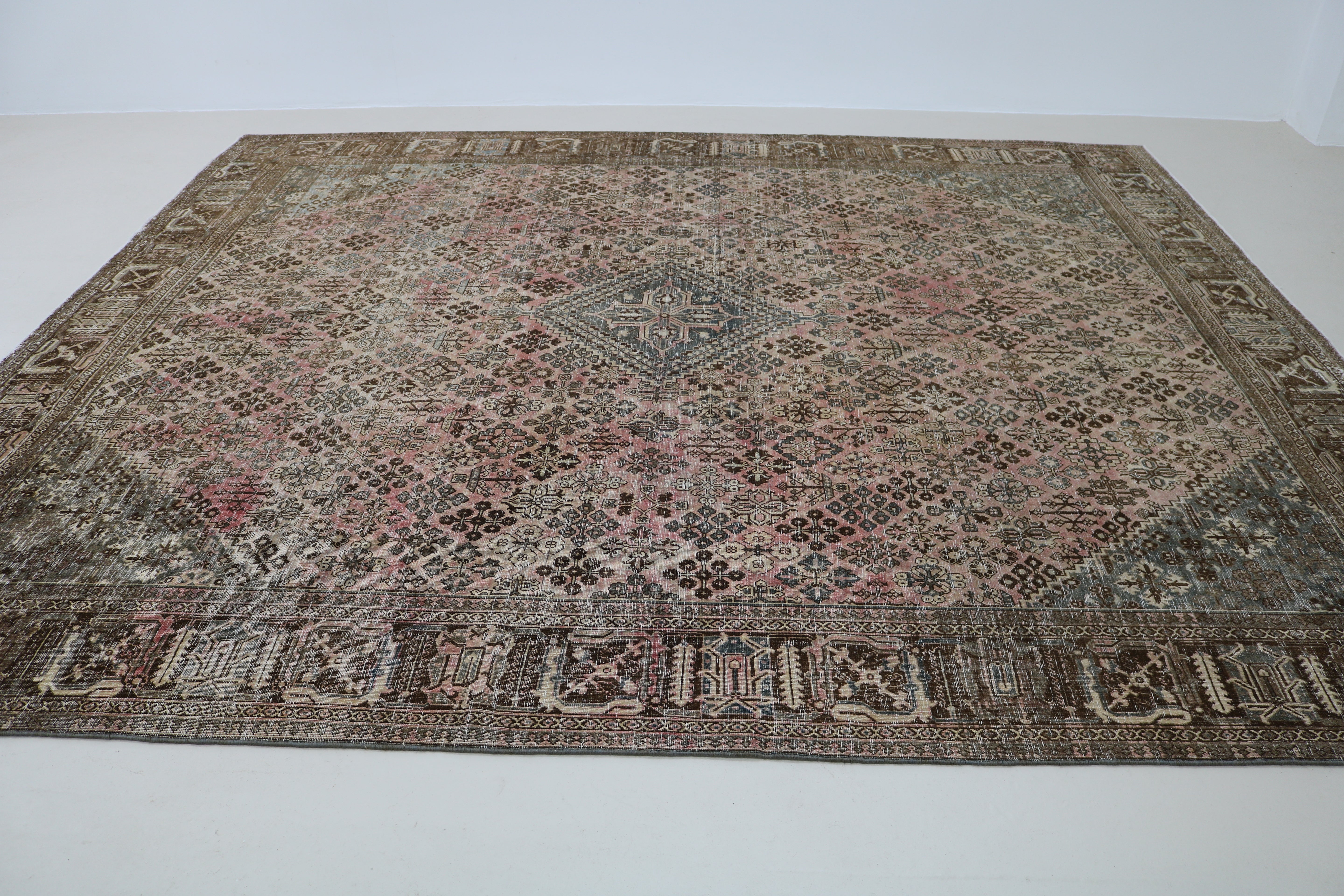 Perspective view of Persian Josheqan carpet on floor
