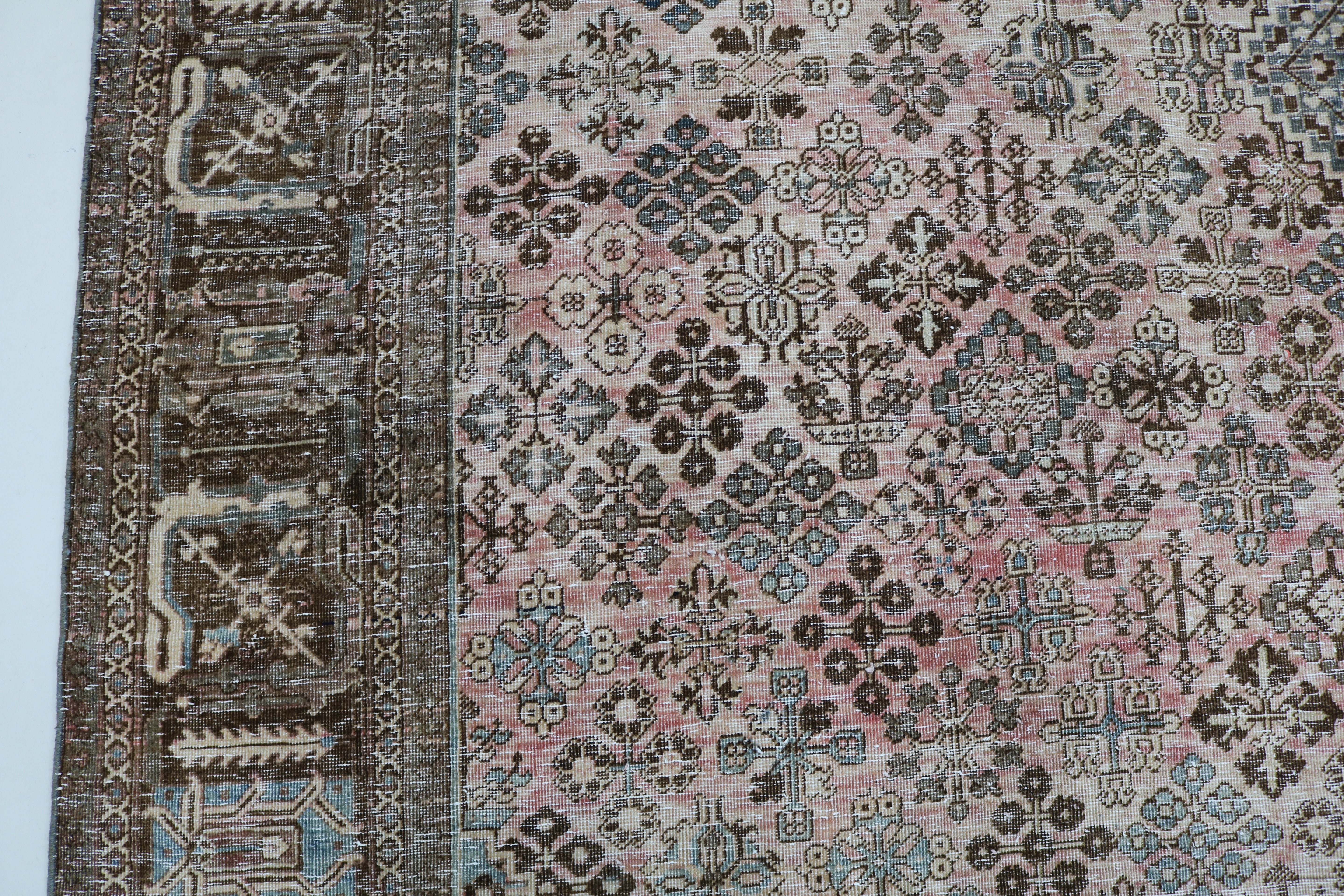 Close-up of hand-knotted wool texture on Persian Josheqan carpet