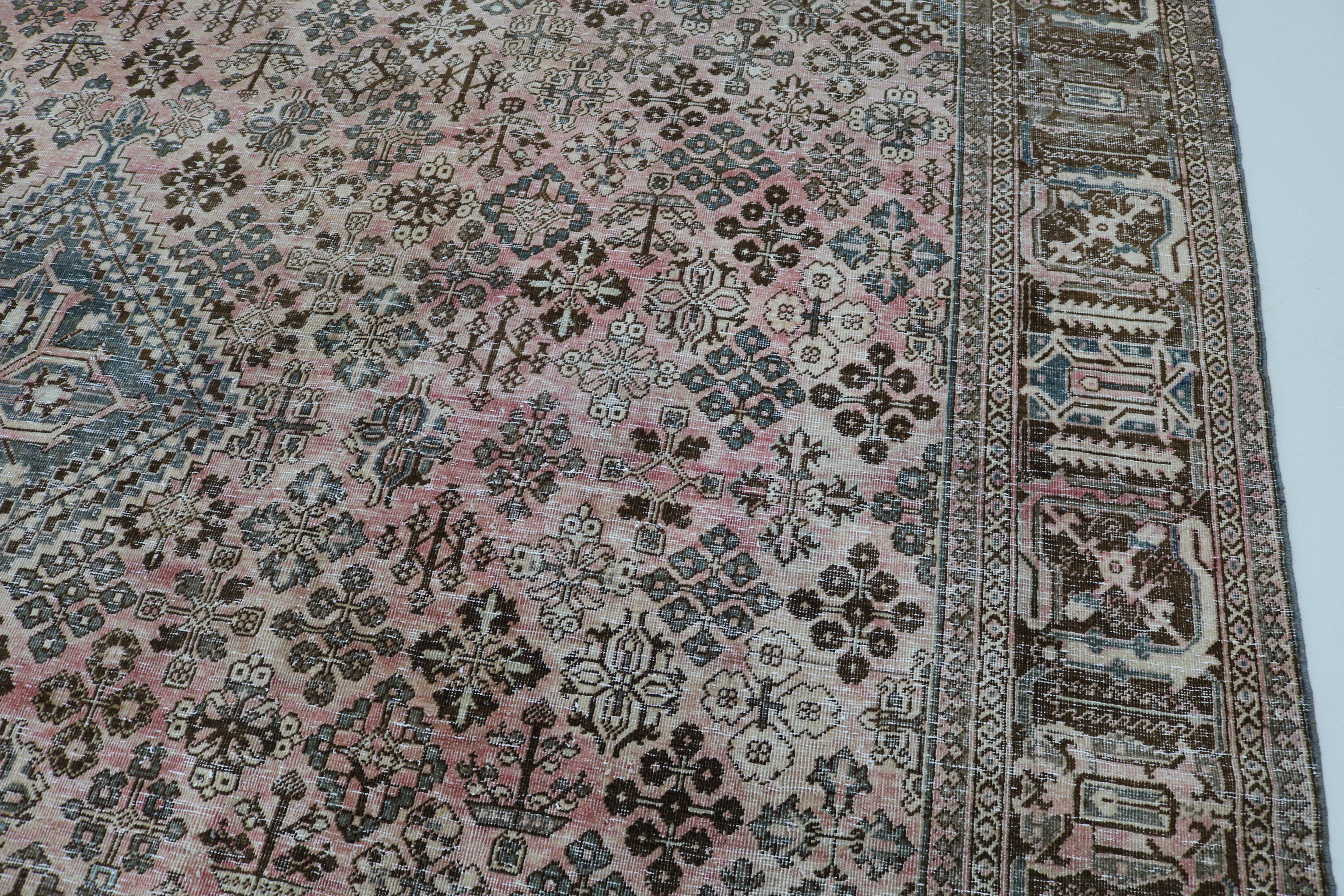 Close-up of hand-knotted wool texture on Persian Josheqan carpet