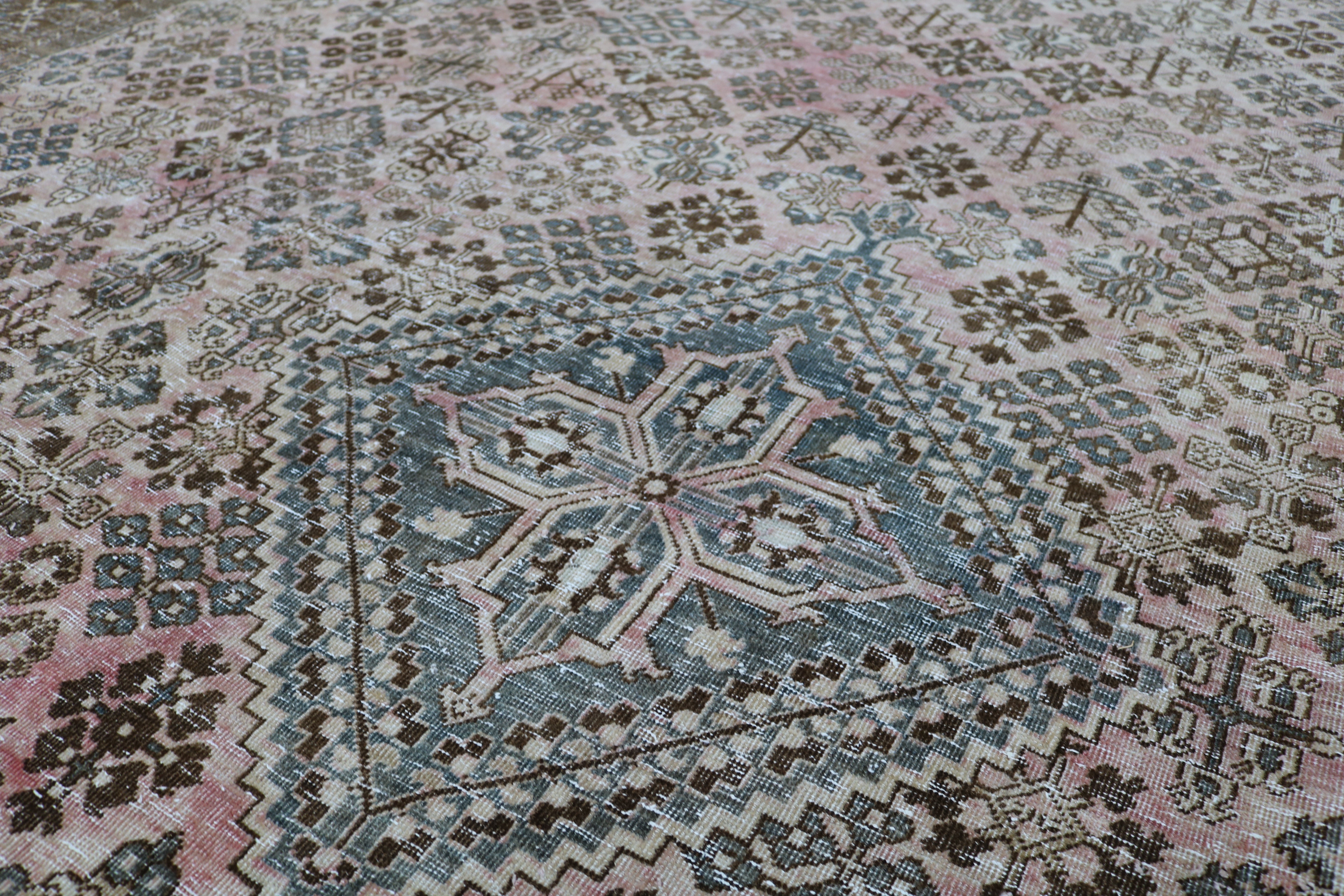 Close-up of hand-knotted wool texture on Persian Josheqan carpet