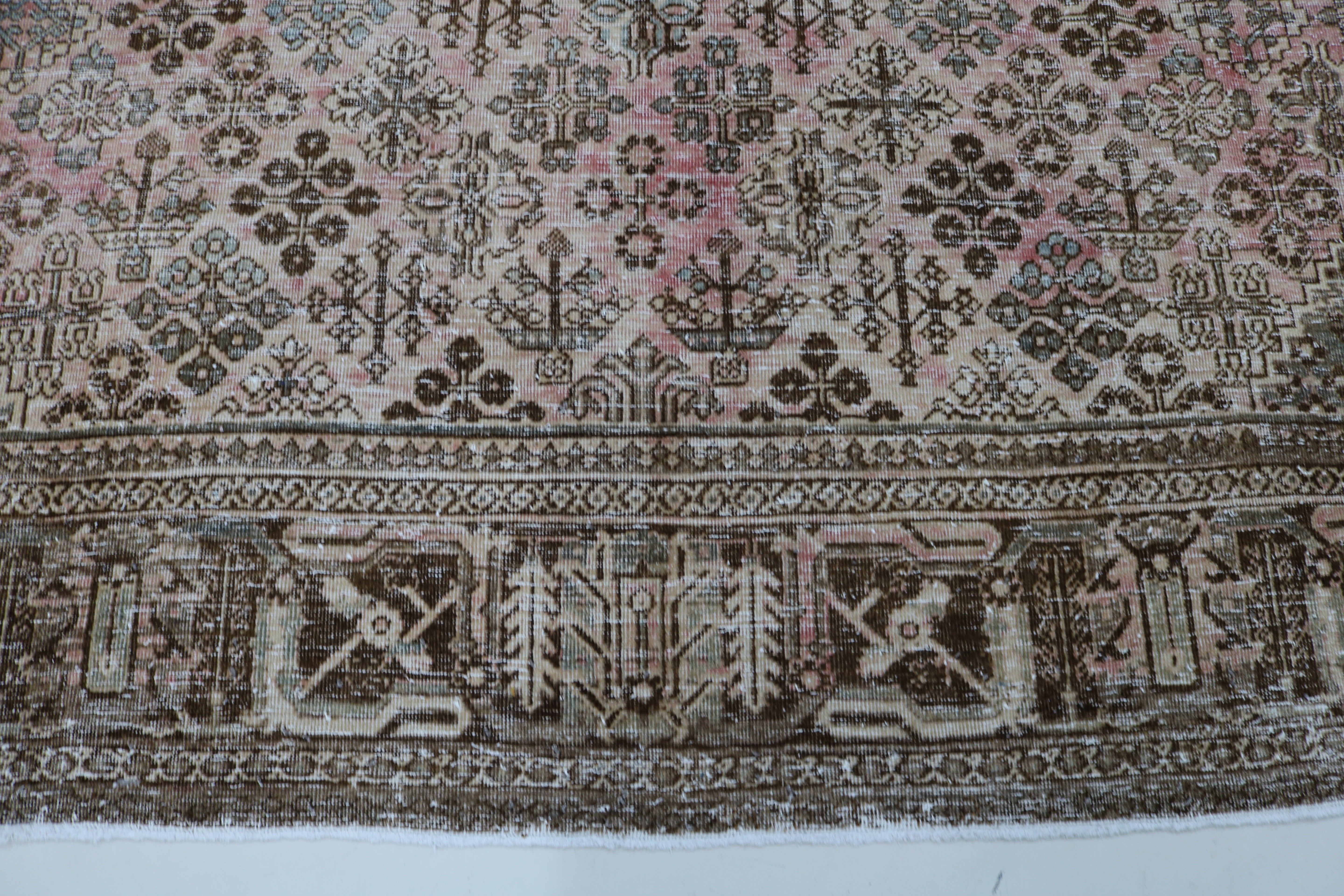 Close-up of hand-knotted wool texture on Persian Josheqan carpet