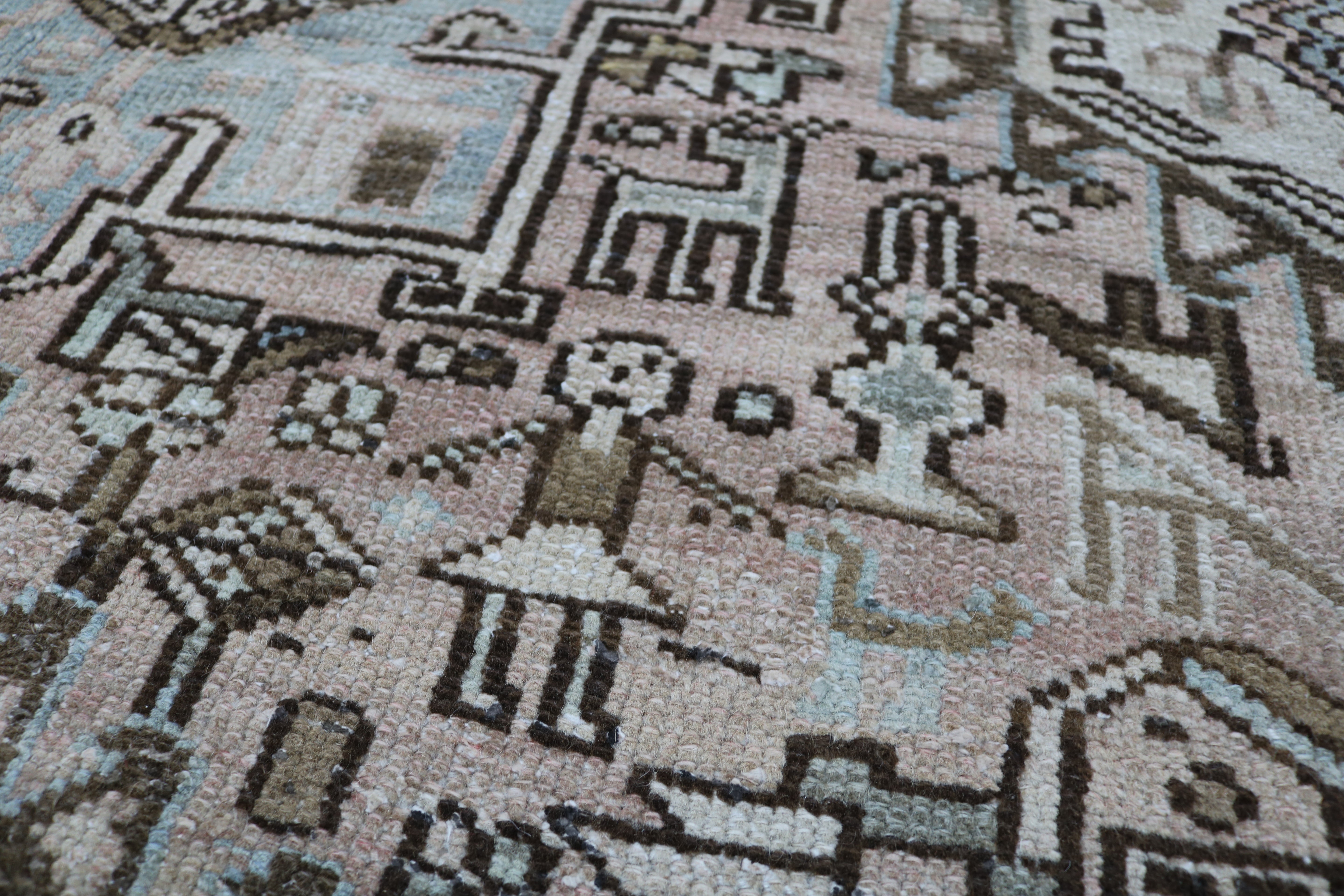 Close-up of hand-knotted wool texture on antique Persian Heriz–Karaja carpet