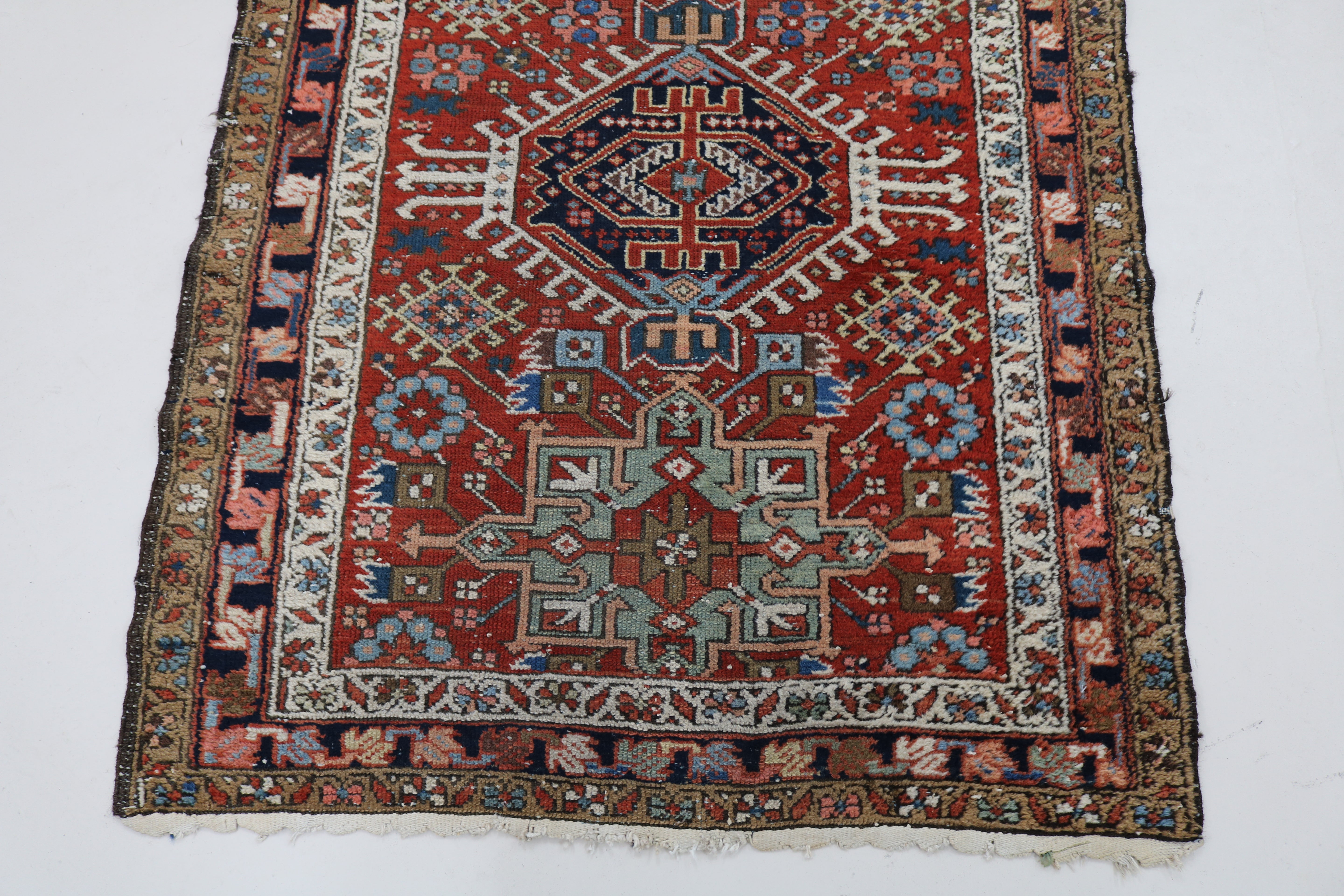 Close-up of hand-knotted wool texture on antique Persian Karaja runner