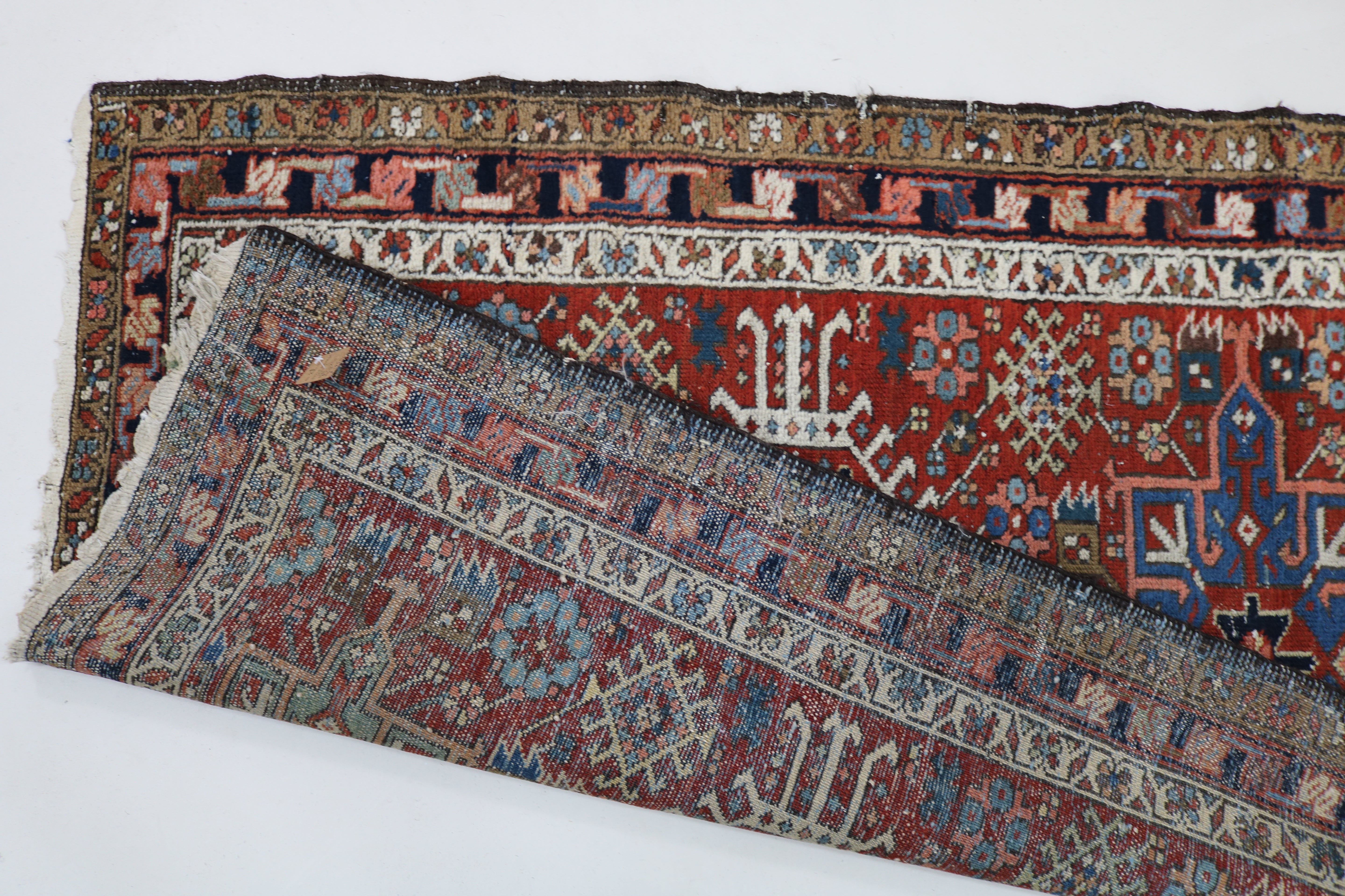 backside view of Close-up of hand-knotted wool texture on antique Persian Karaja runner