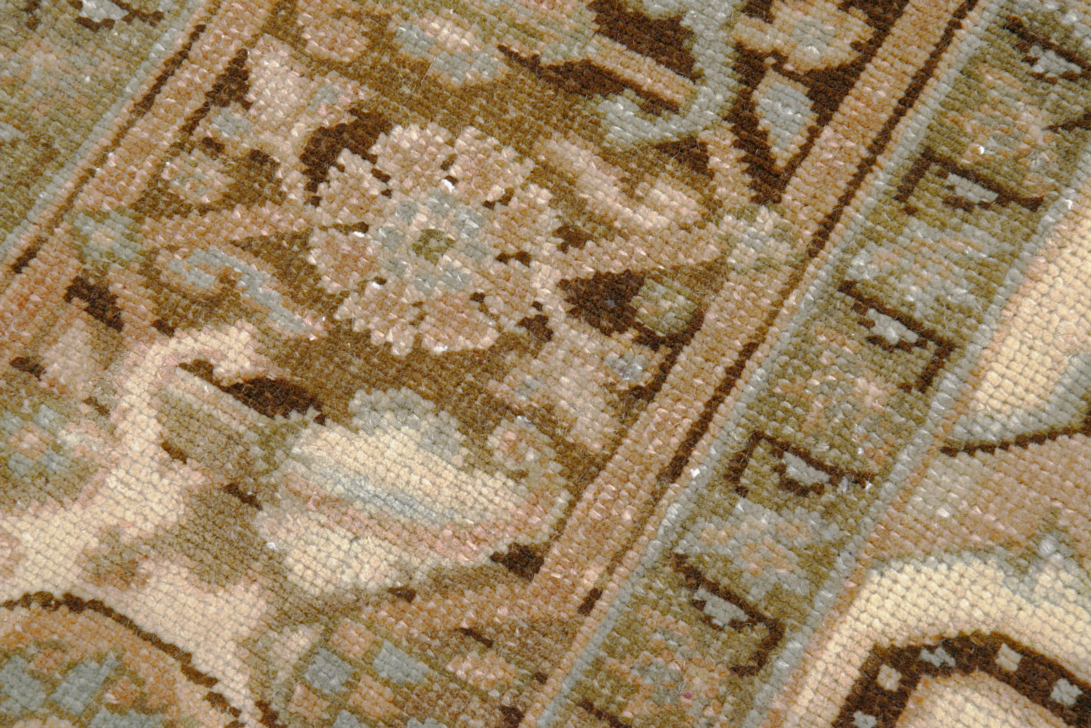 Close-up details of vintage Persian Heriz carpet showing wool texture, motifs, and natural patina