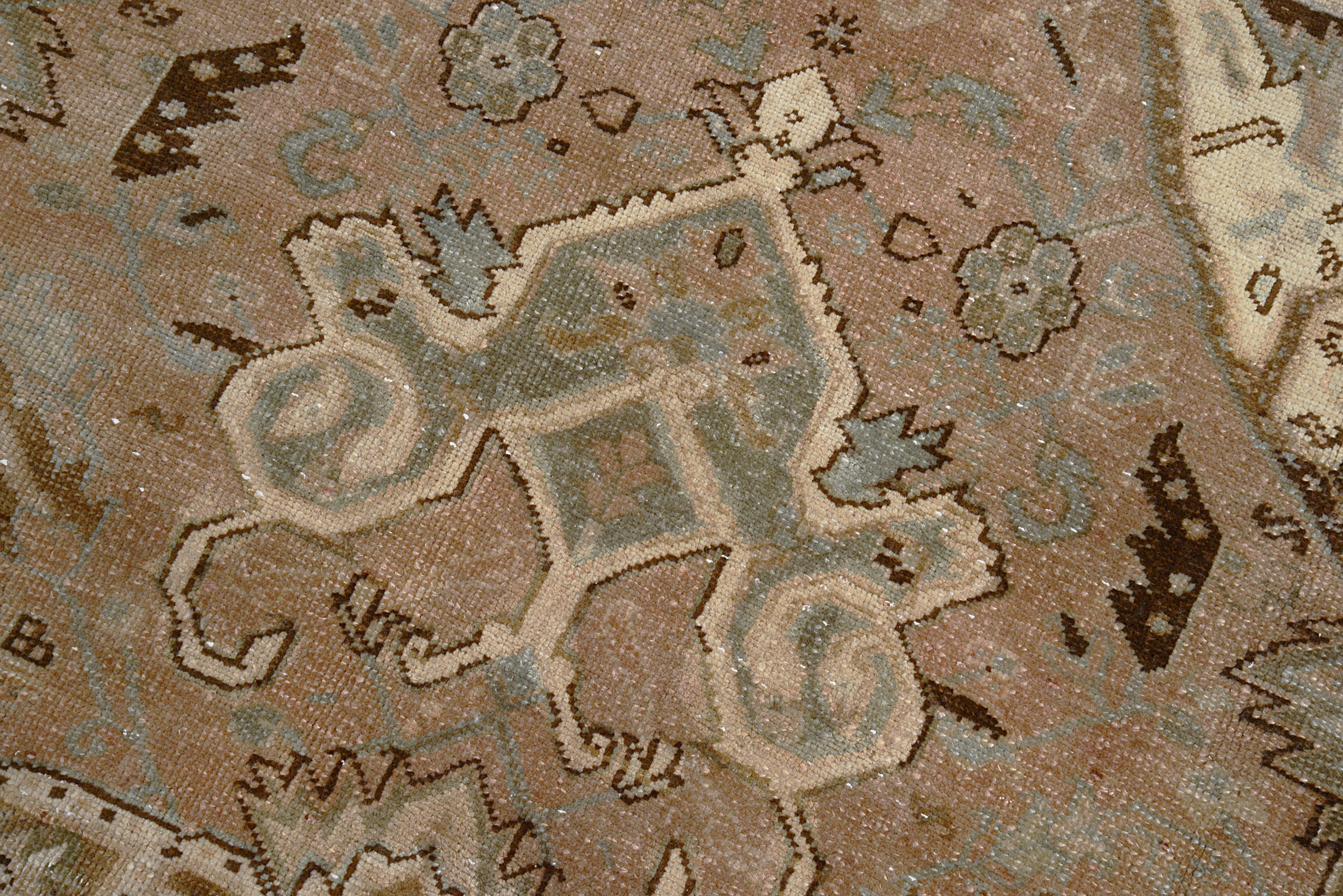 Close-up details of vintage Persian Heriz carpet showing wool texture, motifs, and natural patina
