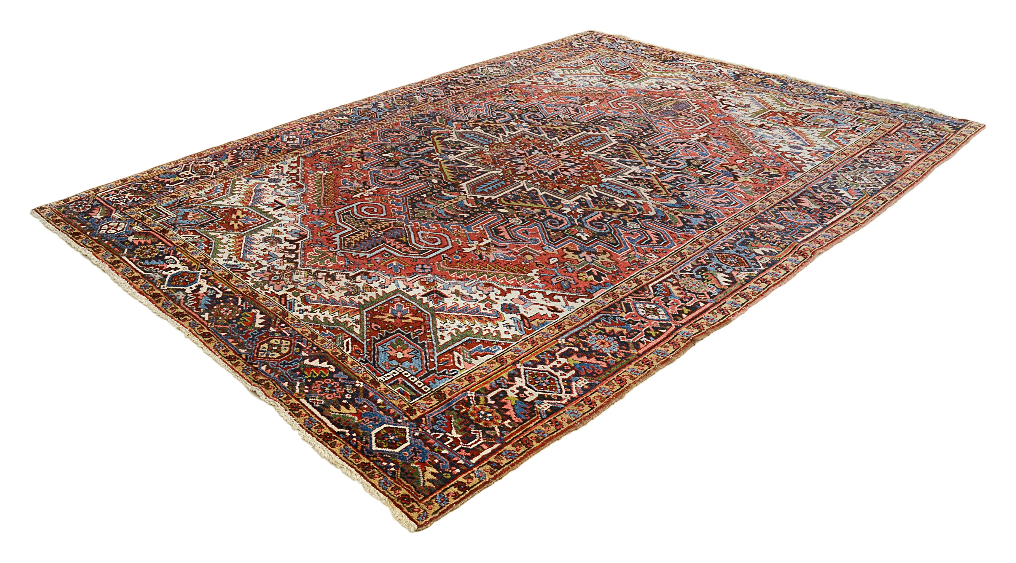 Large antique Heriz carpet from Persia featuring architectural pattern and rich natural colours