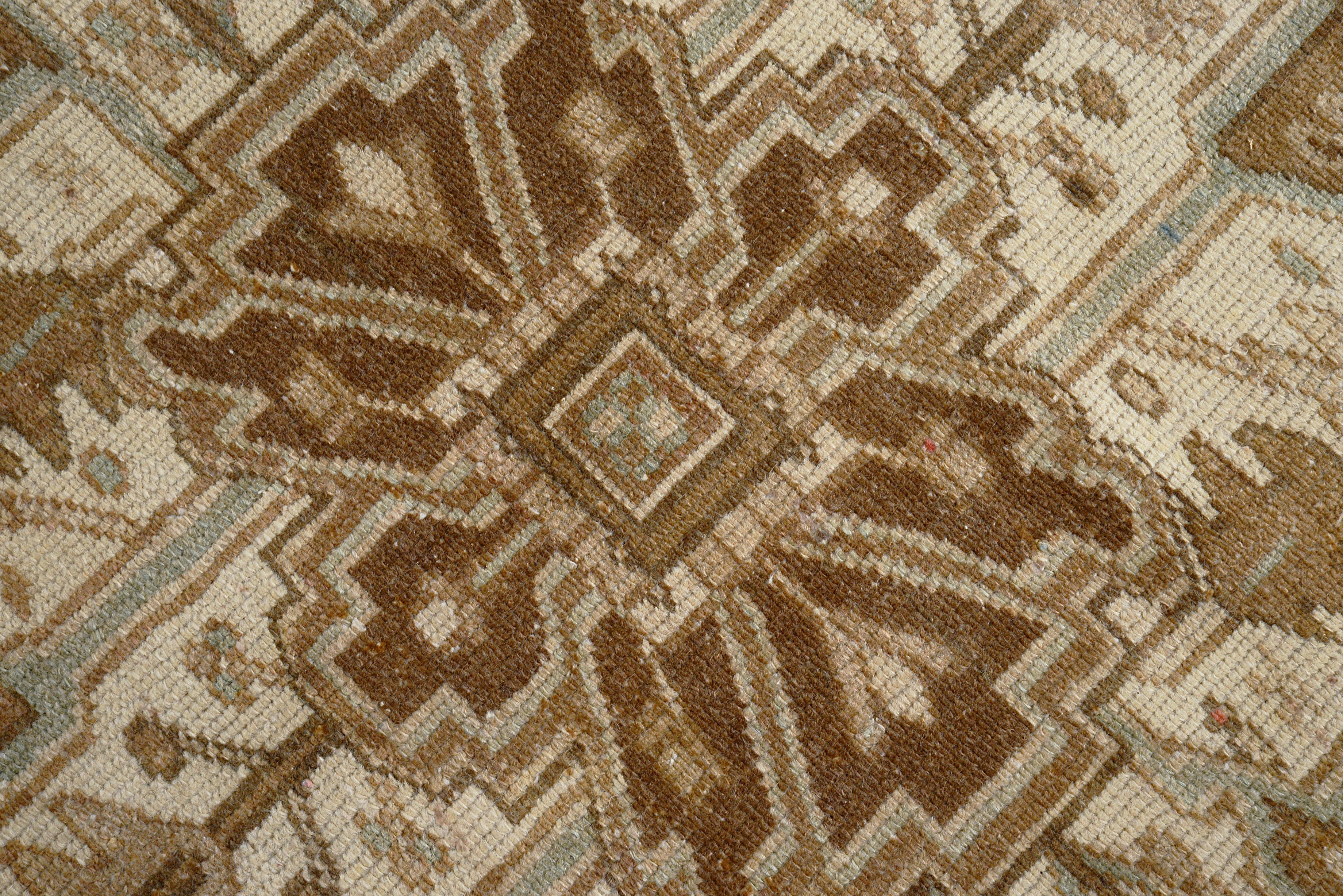 Close-up details of vintage Persian Heriz carpet showing wool texture, motifs, and natural patina