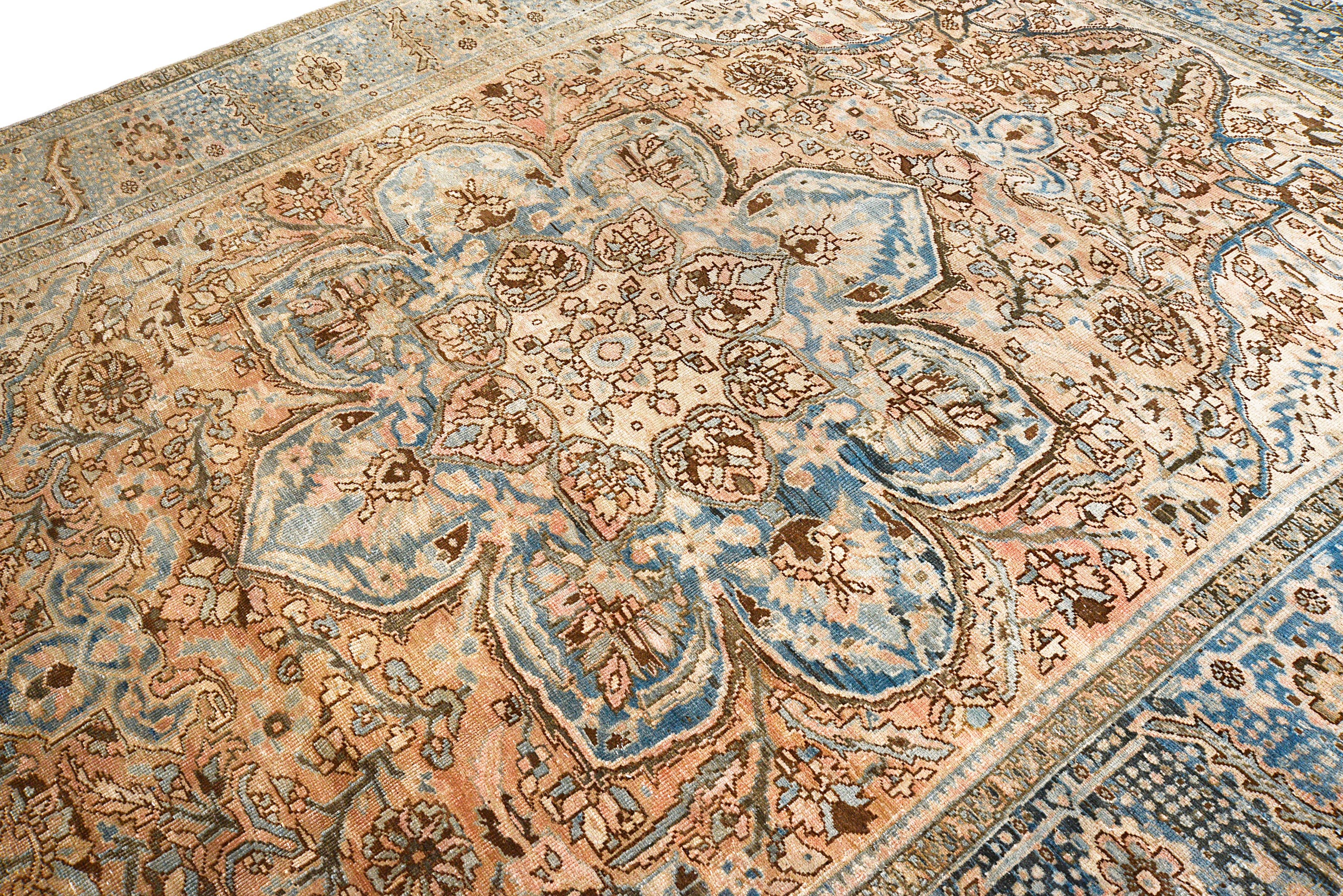 Close-up details of vintage Persian Heriz carpet showing wool texture, motifs, and natural patina