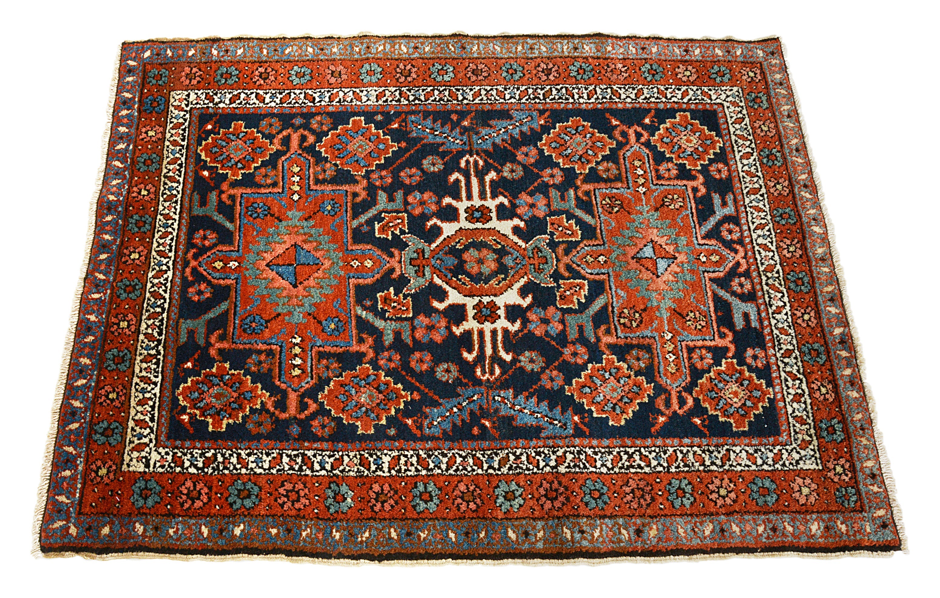 Hand-knotted antique Heriz rug with central medallion and rich natural colours