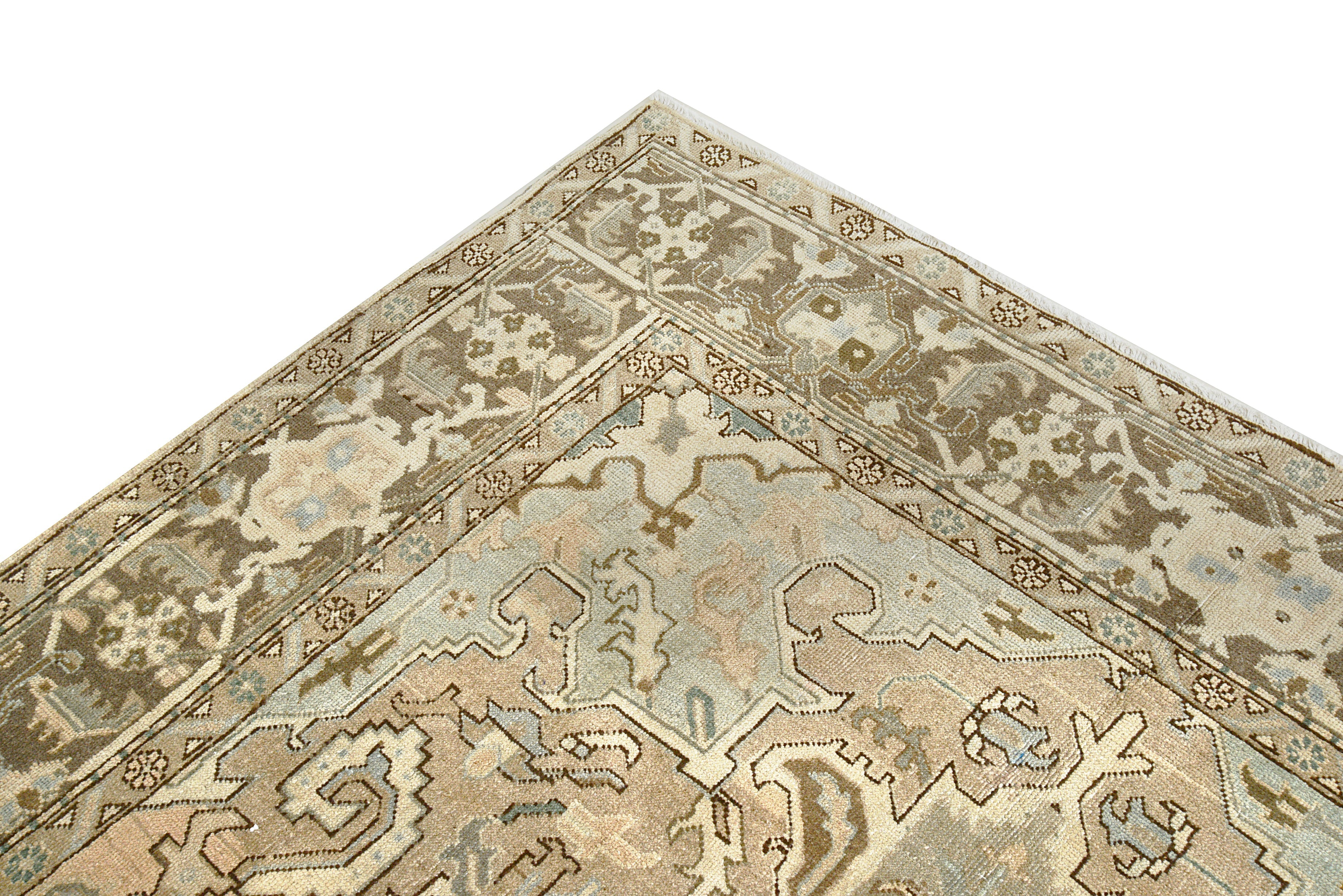Close-up details of vintage Persian Heriz rug showing wool texture, motifs, and natural patina