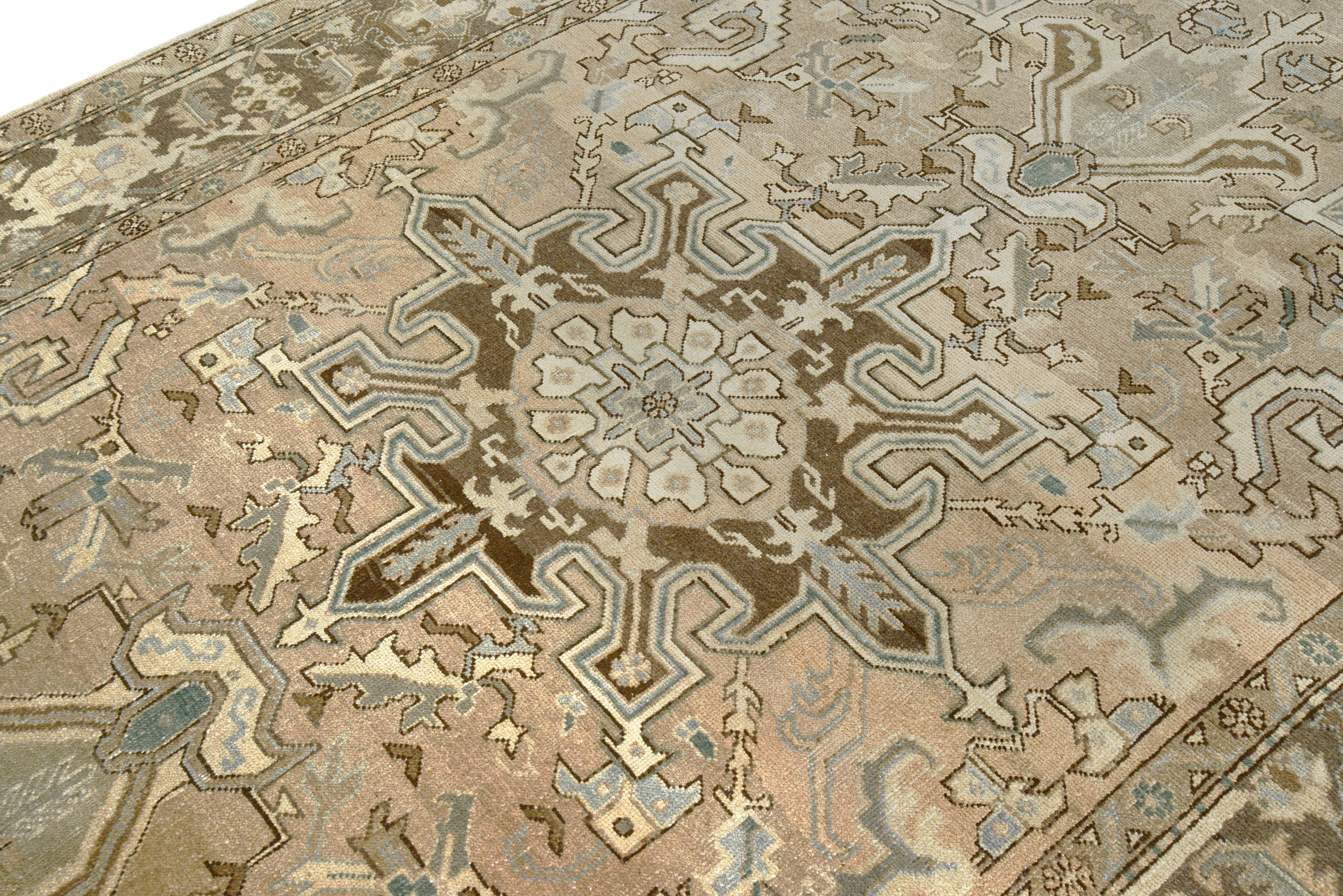 Close-up details of vintage Persian Heriz rug showing wool texture, motifs, and natural patina
