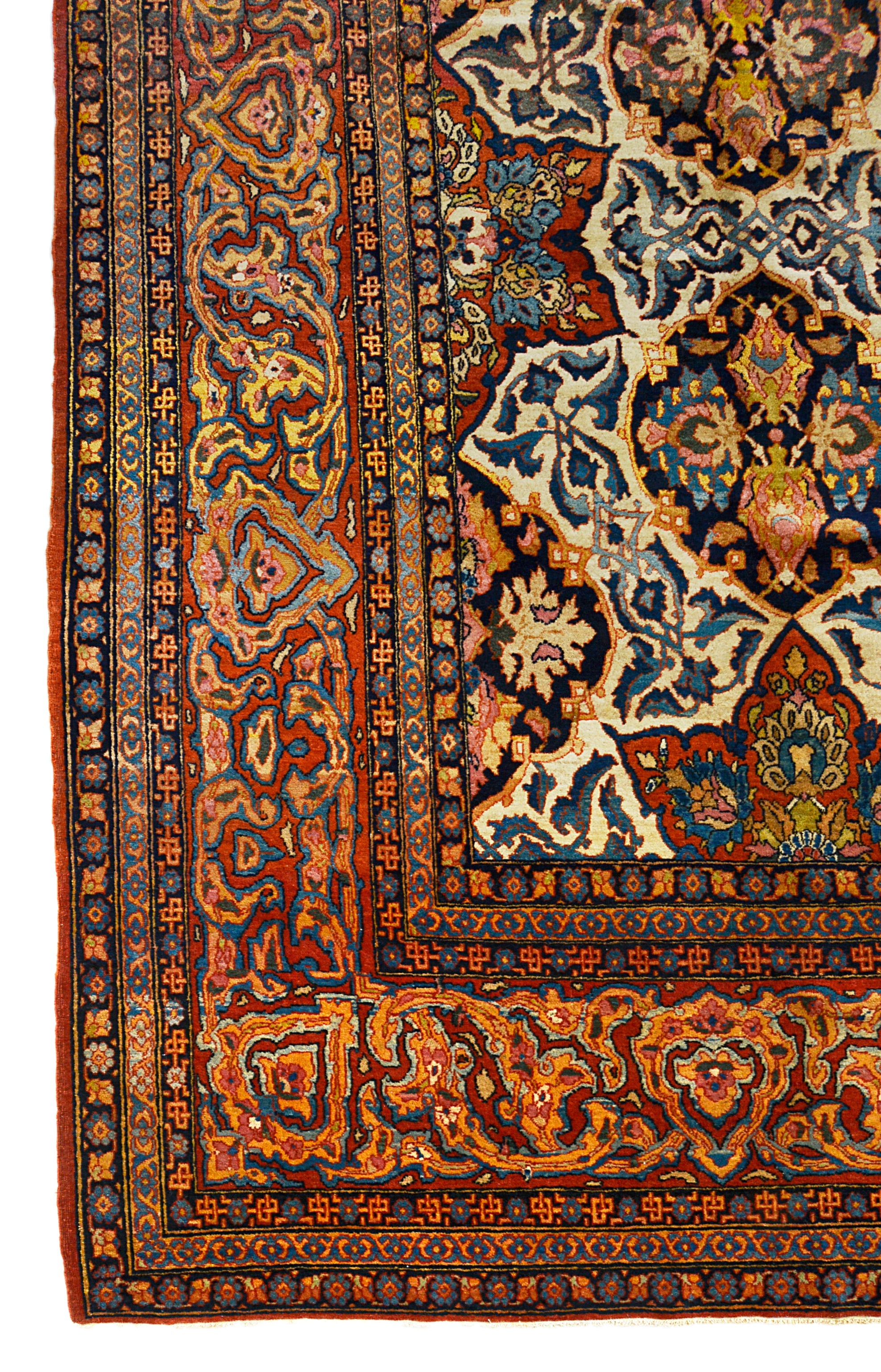 Fine antique Isfahan carpet corner detail showing hand-knotted wool and intricate floral border