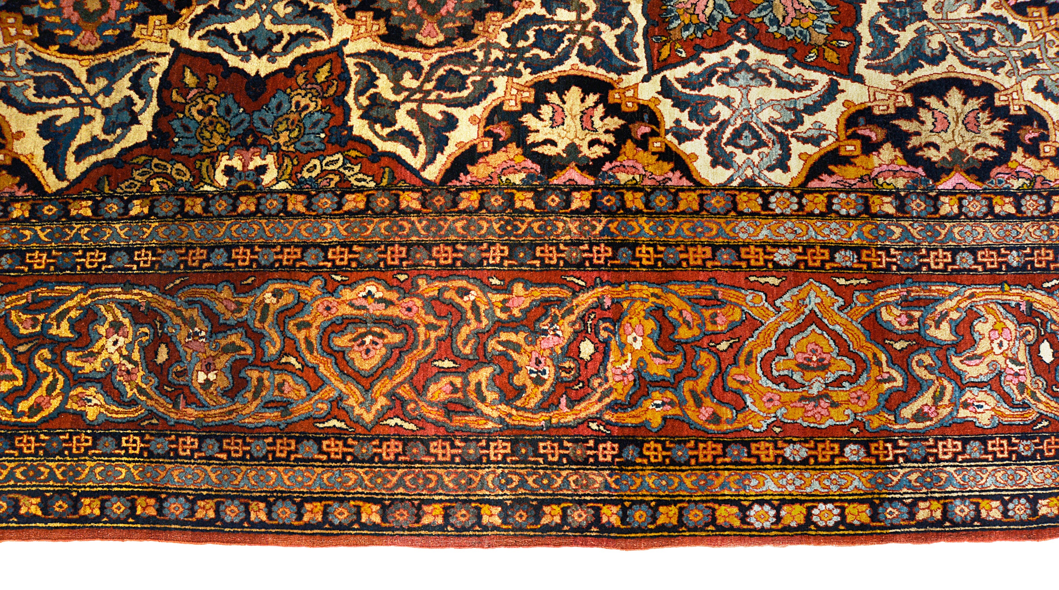 Close-up details of fine antique Isfahan carpet showing wool texture, floral motifs, and aged patina