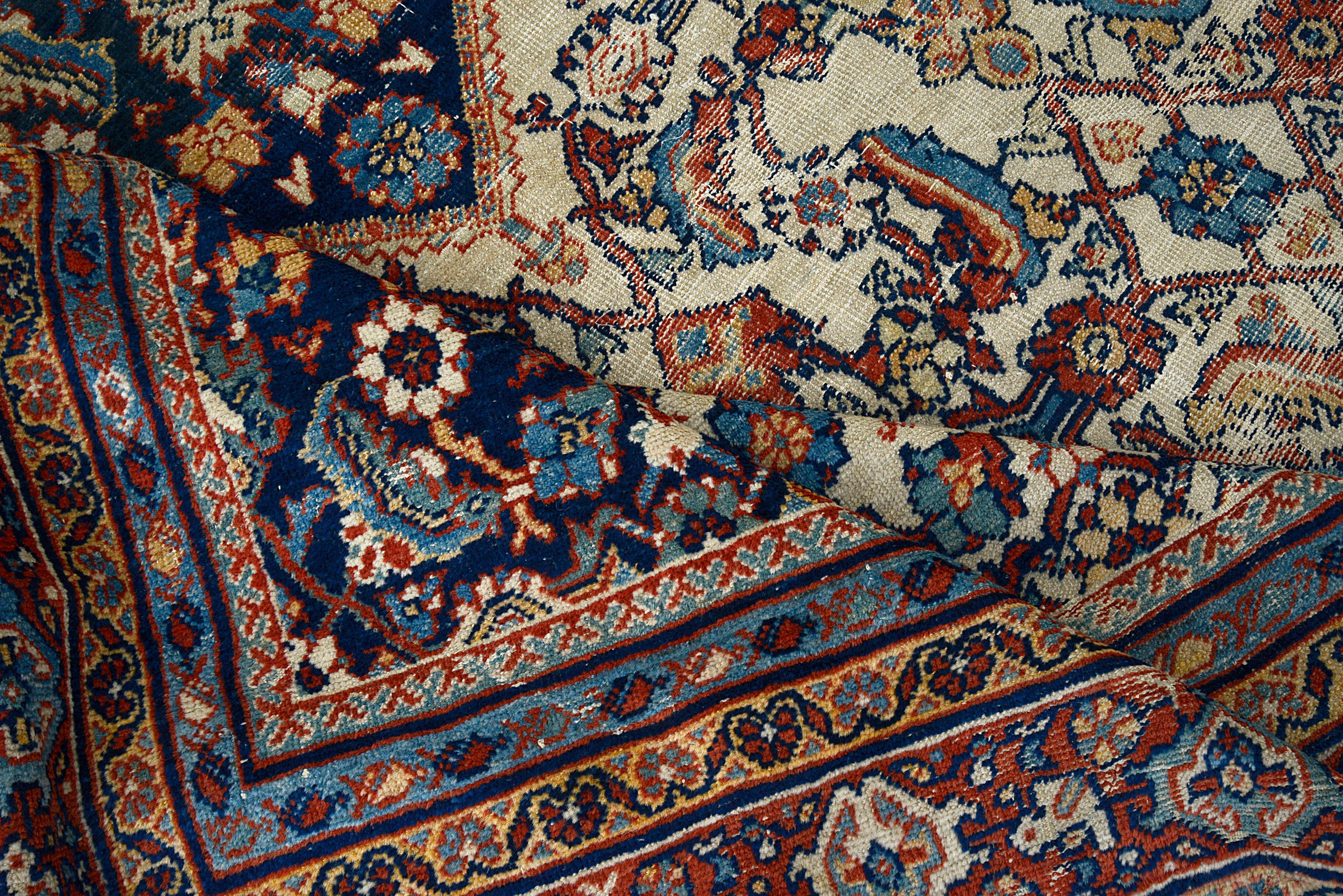 Detailed view of antique Persian Mahal rug showing wool texture and age-related character