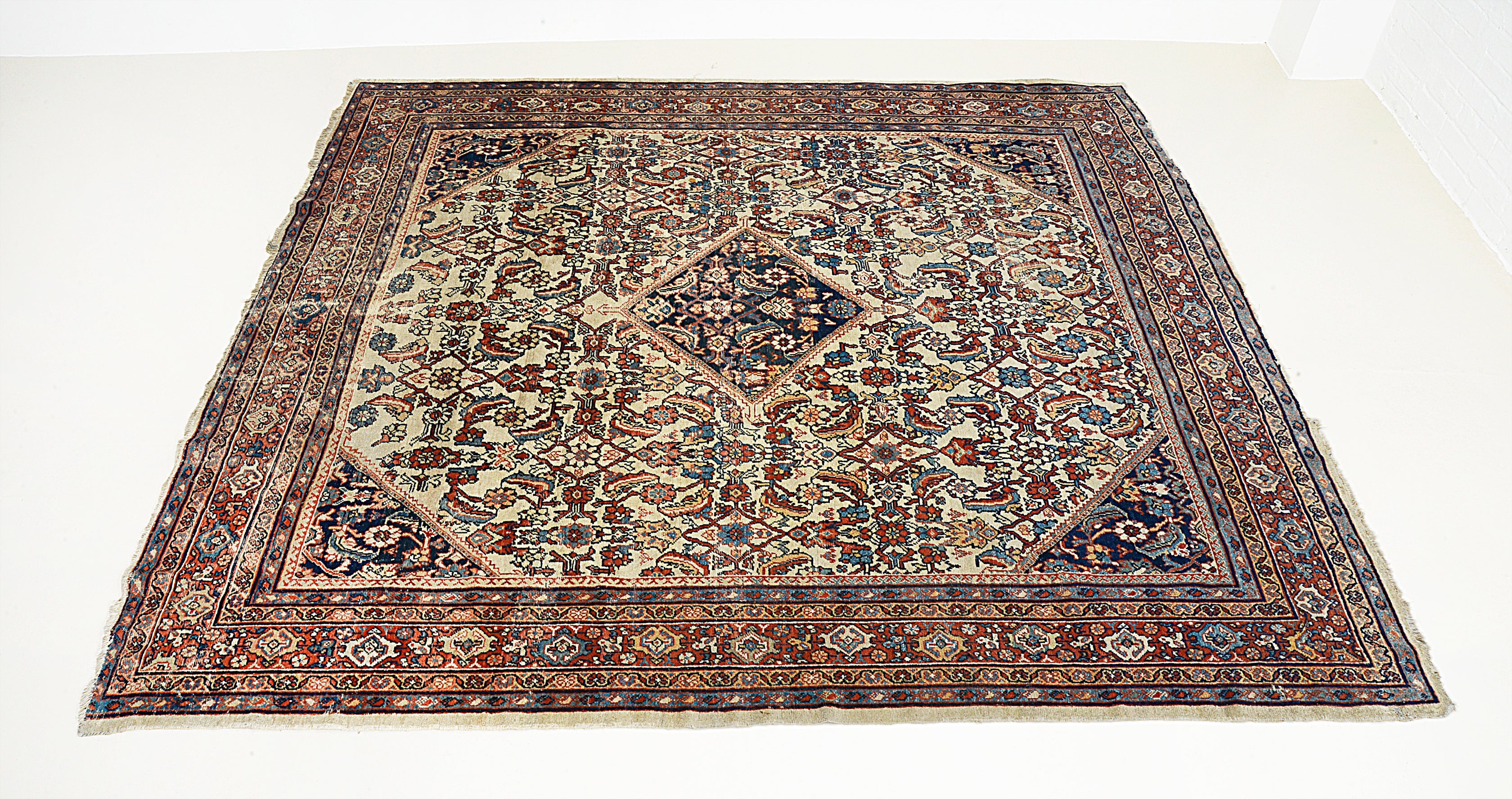 Antique Persian Mahal carpet border detail showing hand-knotted wool and classic motifs