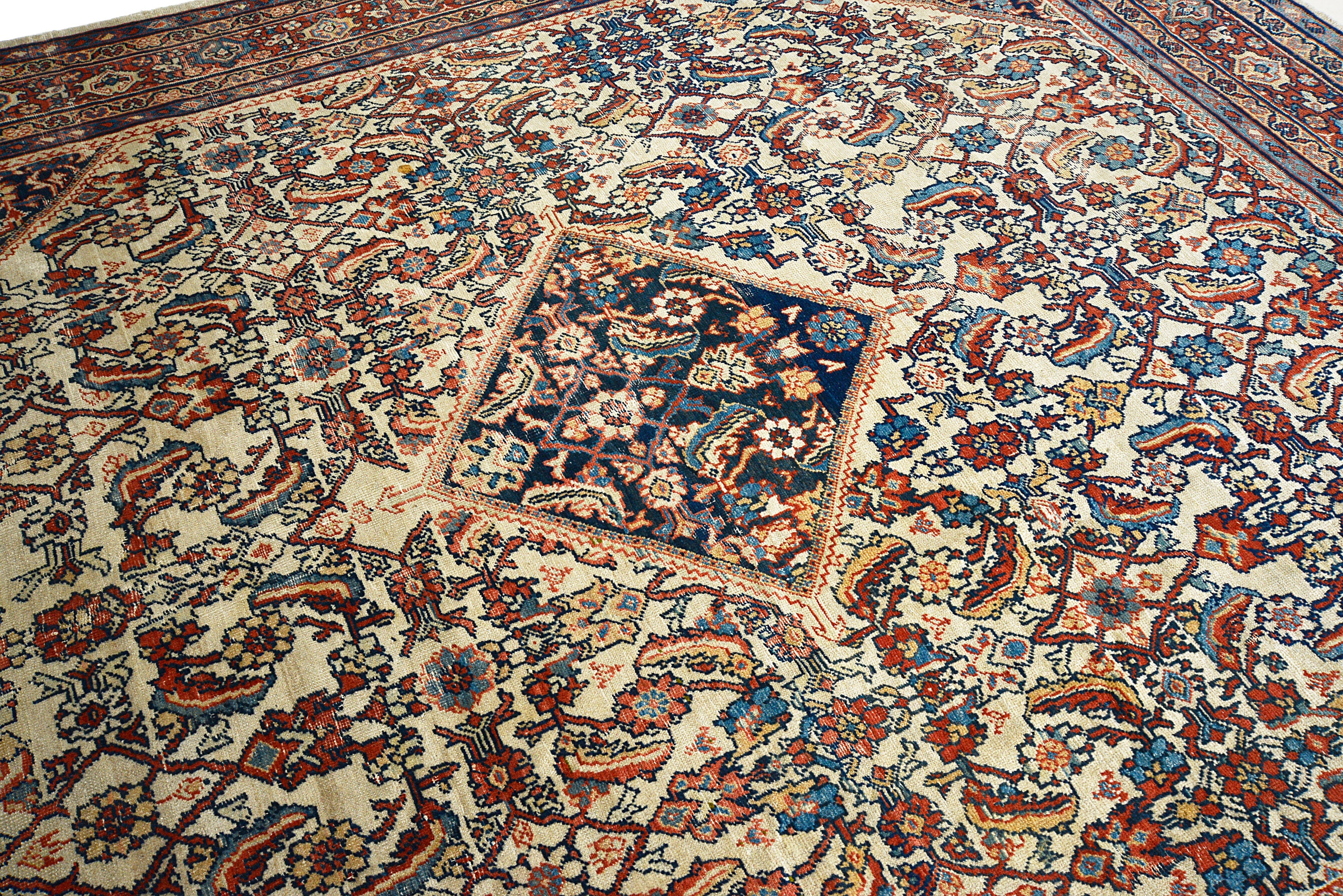 Detailed view of antique Persian Mahal rug showing wool texture and age-related character