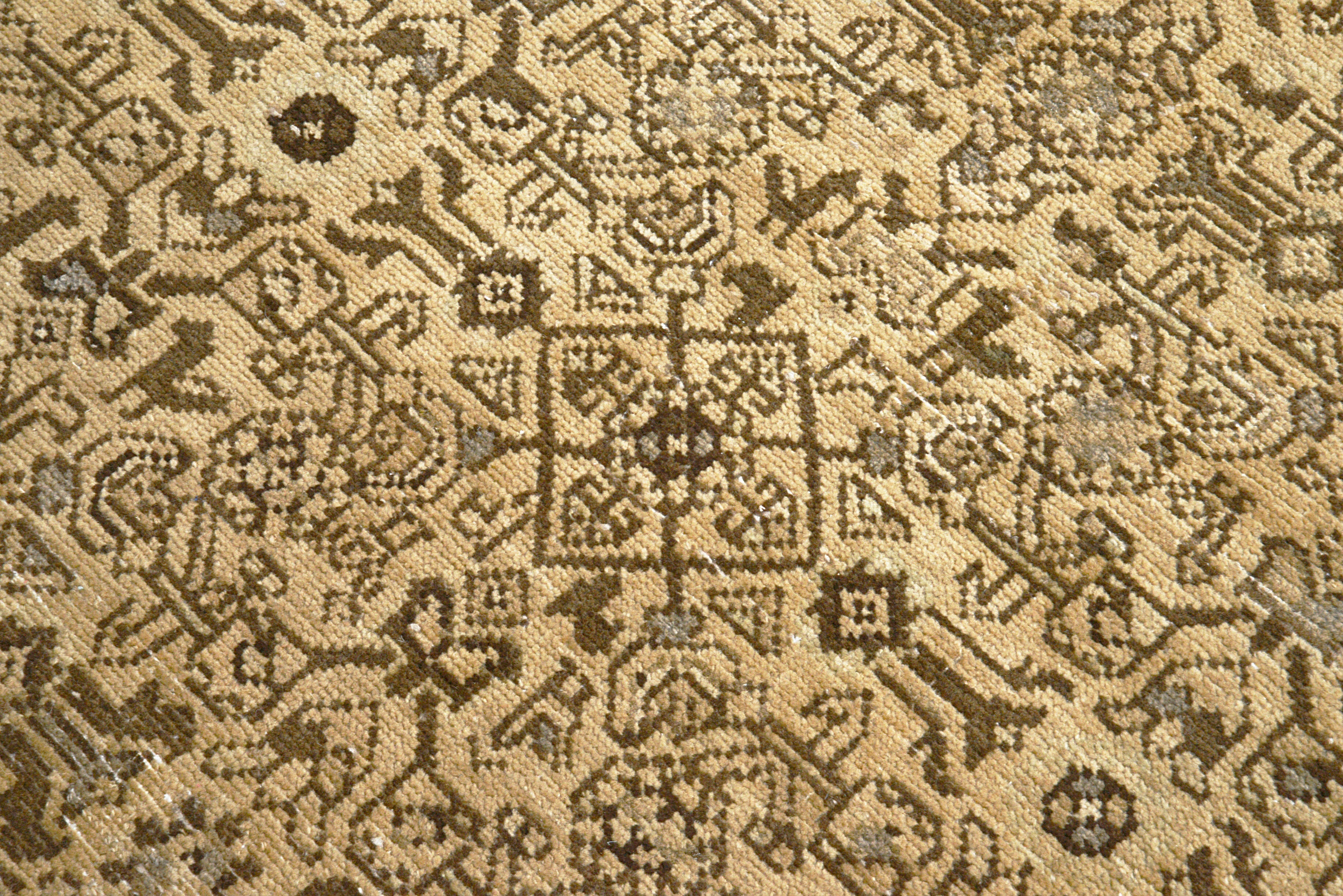 Close-up details of vintage Persian Malayer rug showing wool texture, borders, and natural patina