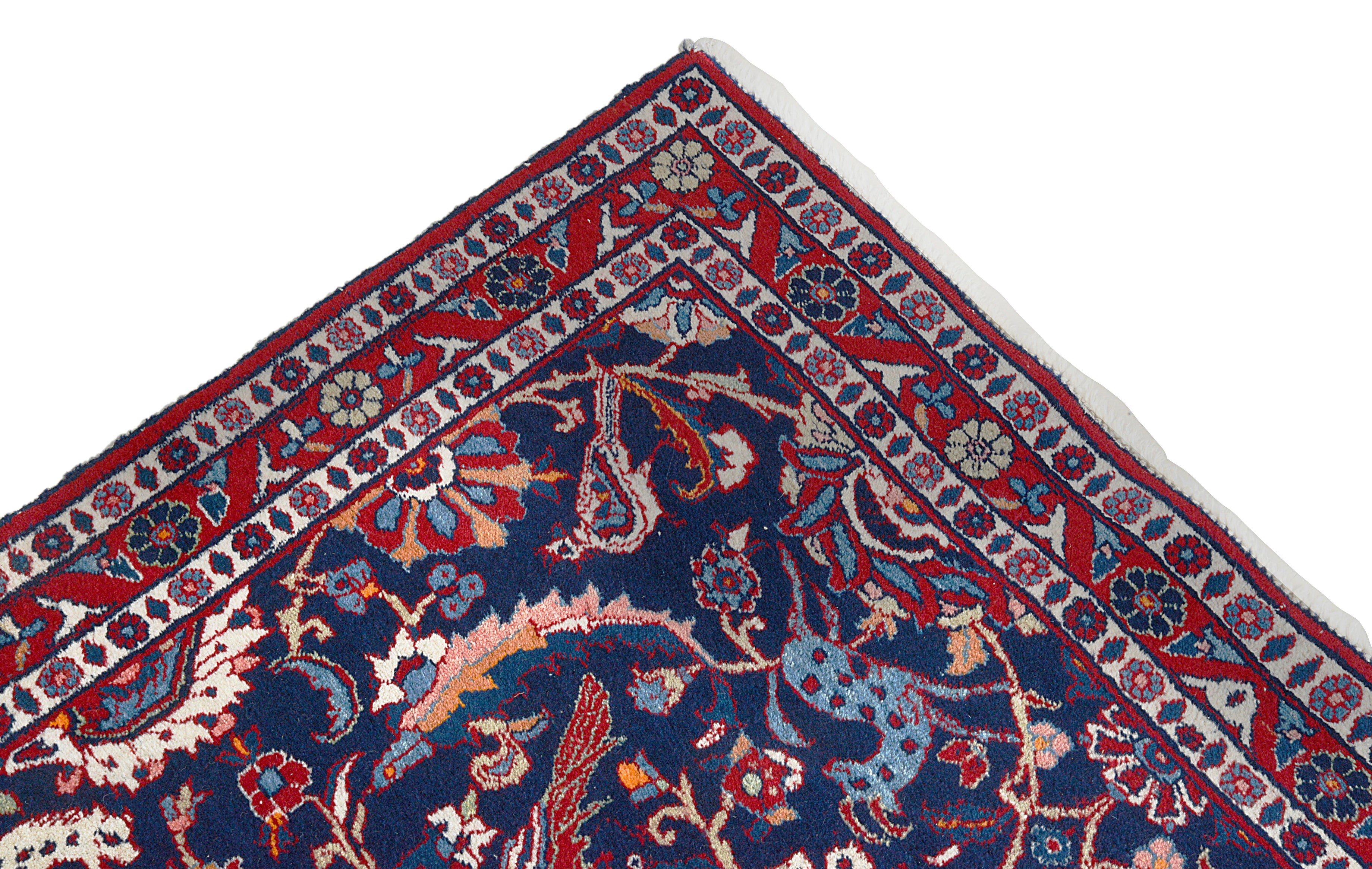 Close-up details of vintage Persian Mashhad rug showing wool texture, motifs, and natural patina