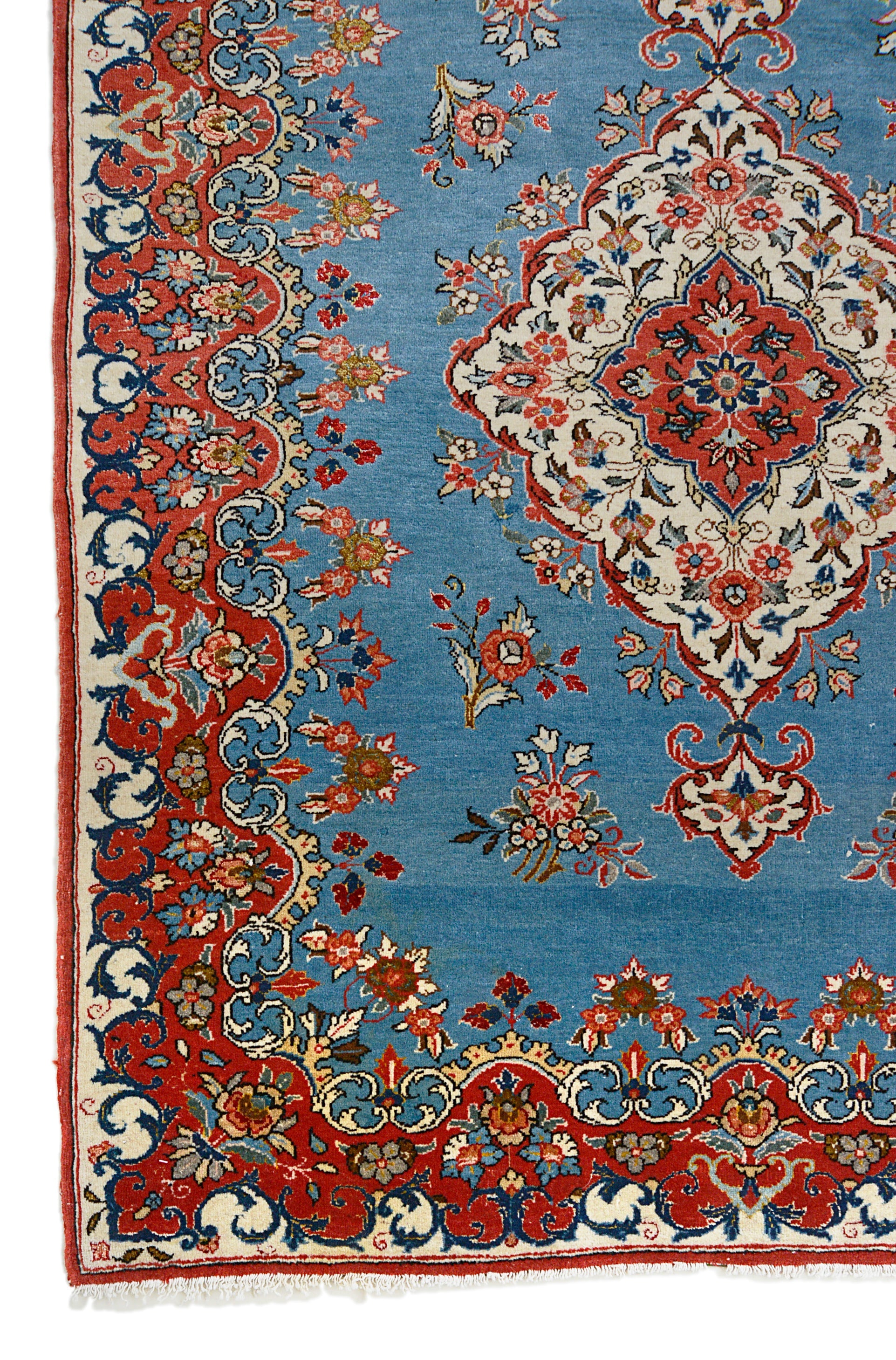 Fine antique Persian Qom rug corner detail showing hand-knotted wool and intricate floral border