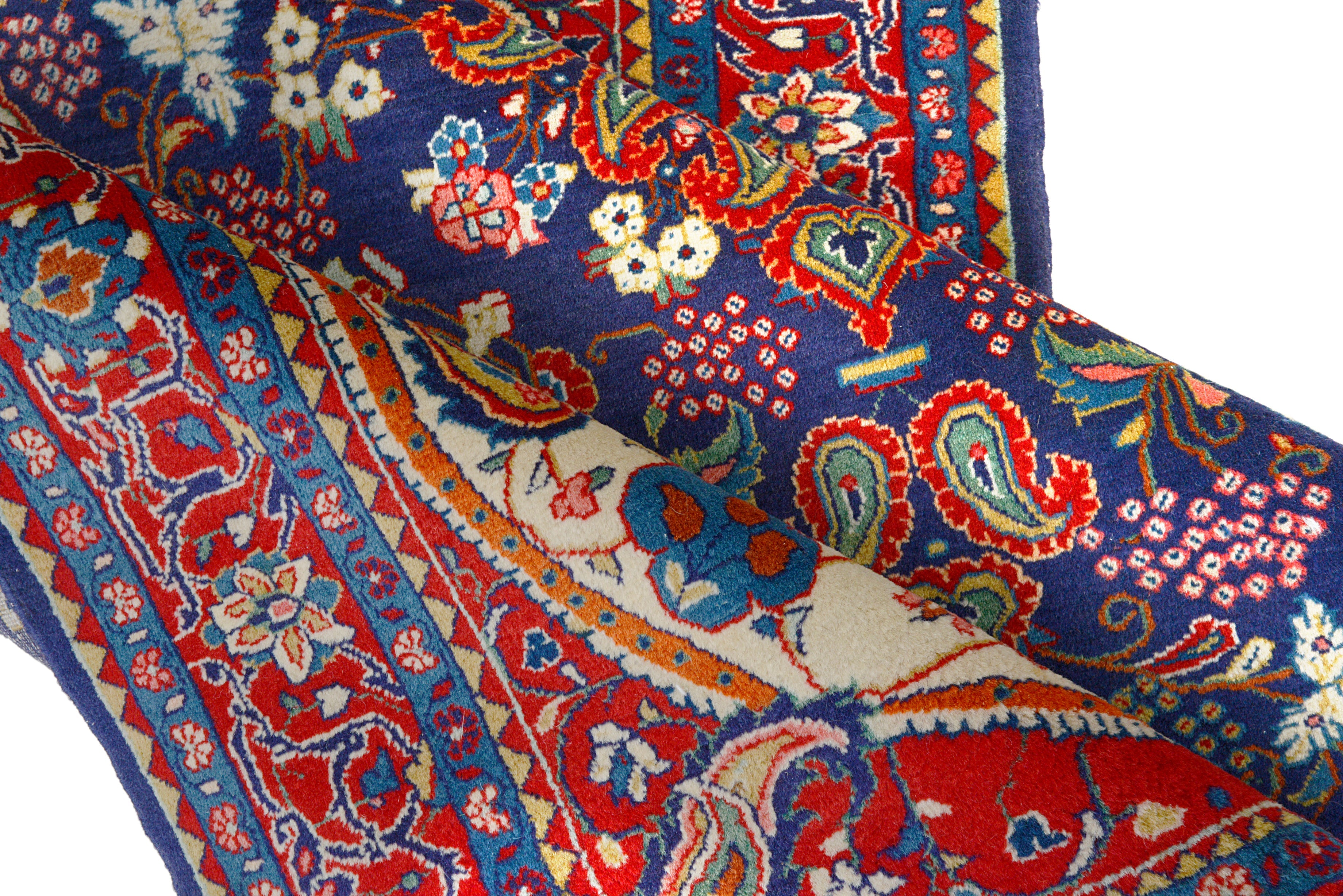Close-up details of vintage Persian Sarouk rug showing wool texture, motifs, and natural patina
