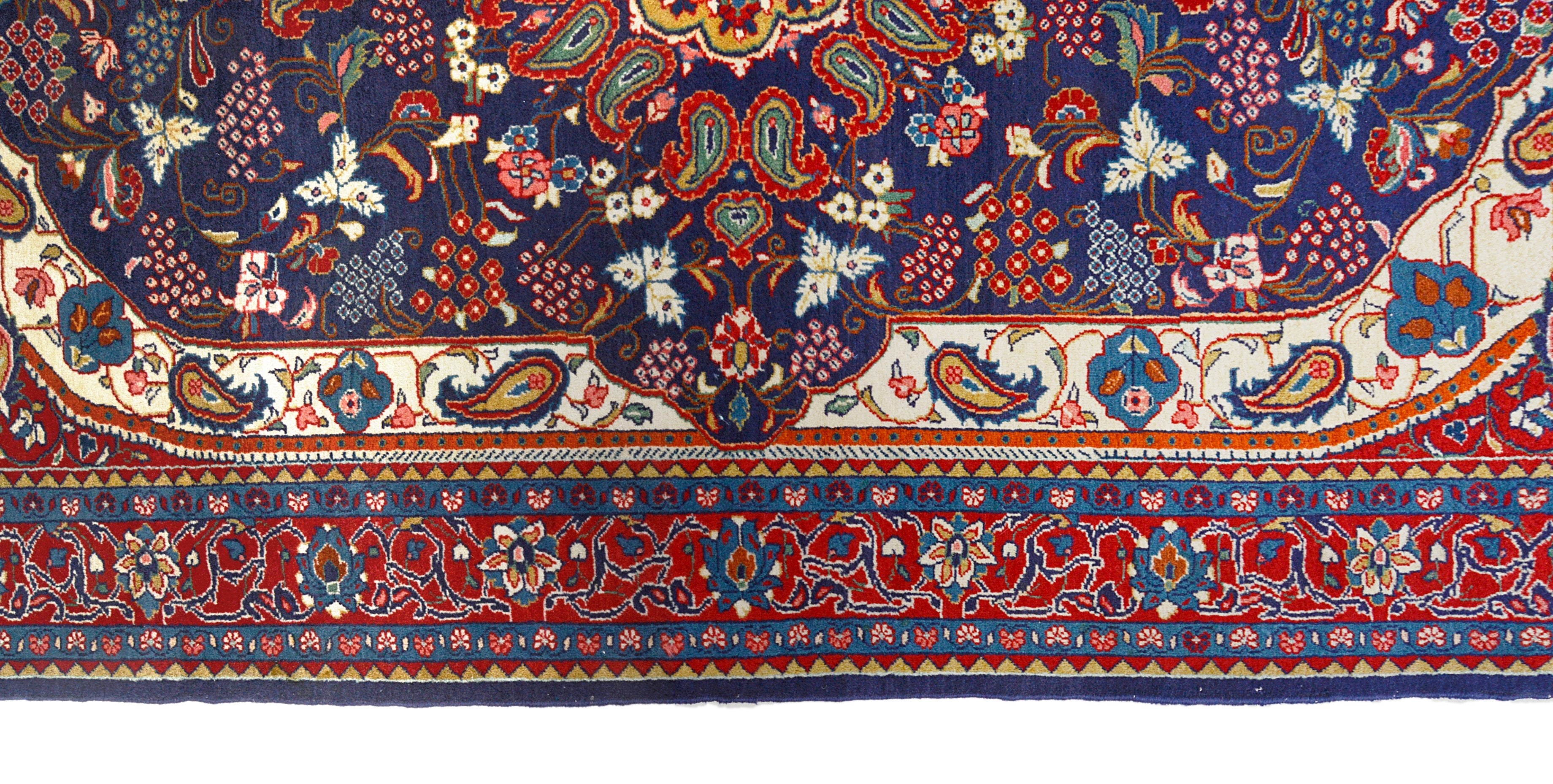 Close-up details of vintage Persian Sarouk rug showing wool texture, motifs, and natural patina