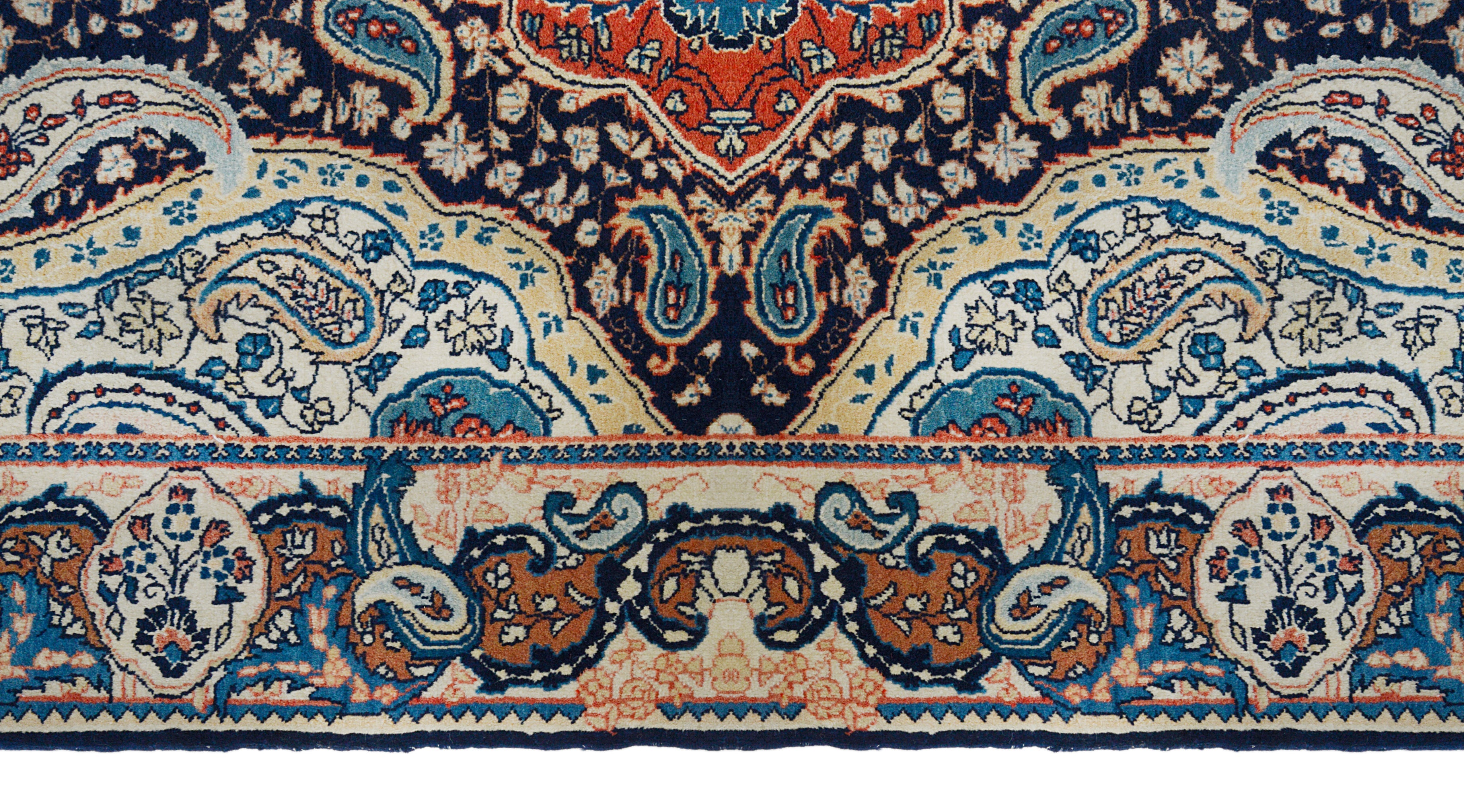 Close-up details of fine antique Persian Sarouk rug showing wool texture, motifs, and aged patina