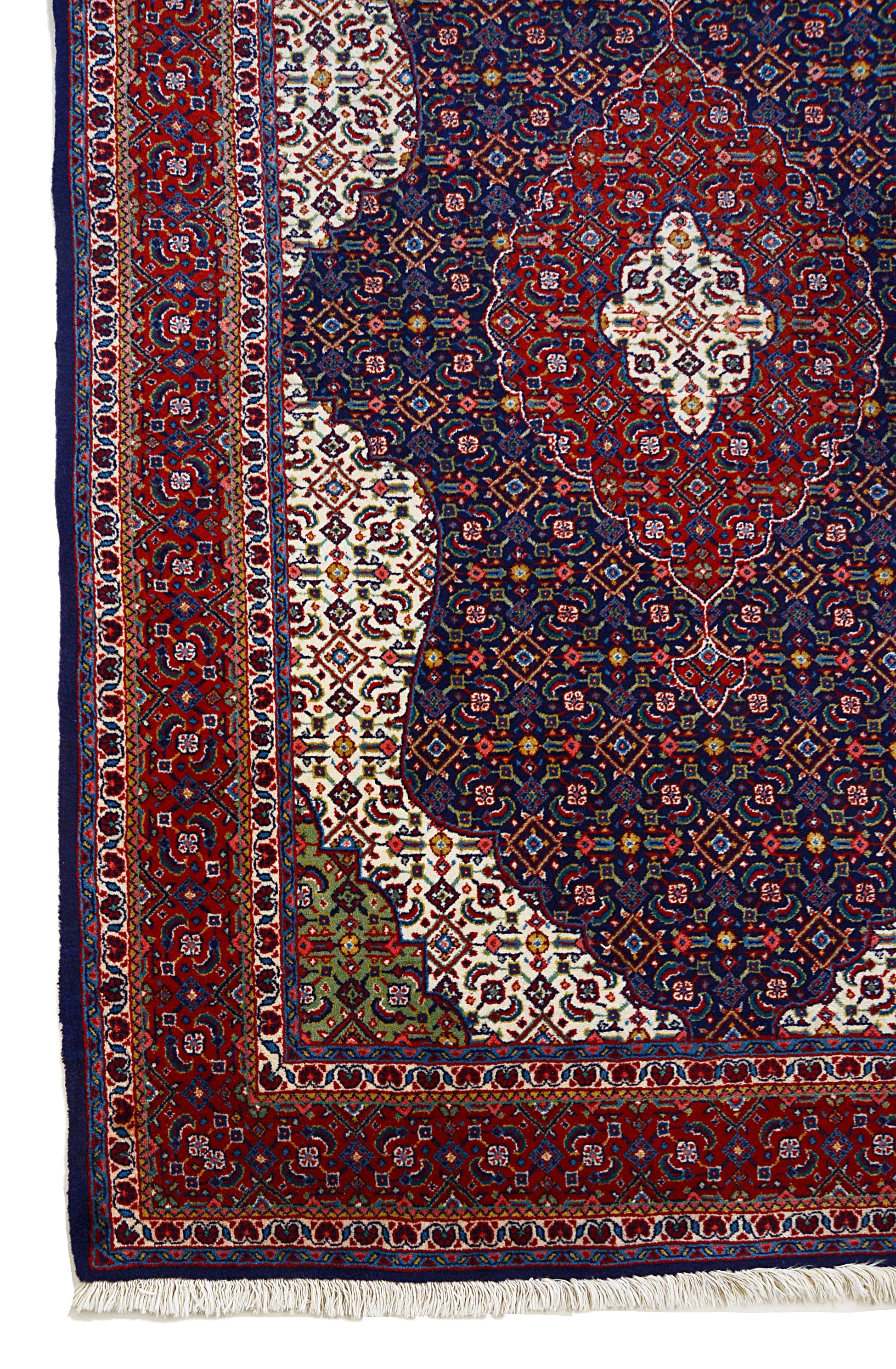 Vintage Persian Sarouk rug corner detail showing hand-knotted wool and floral border