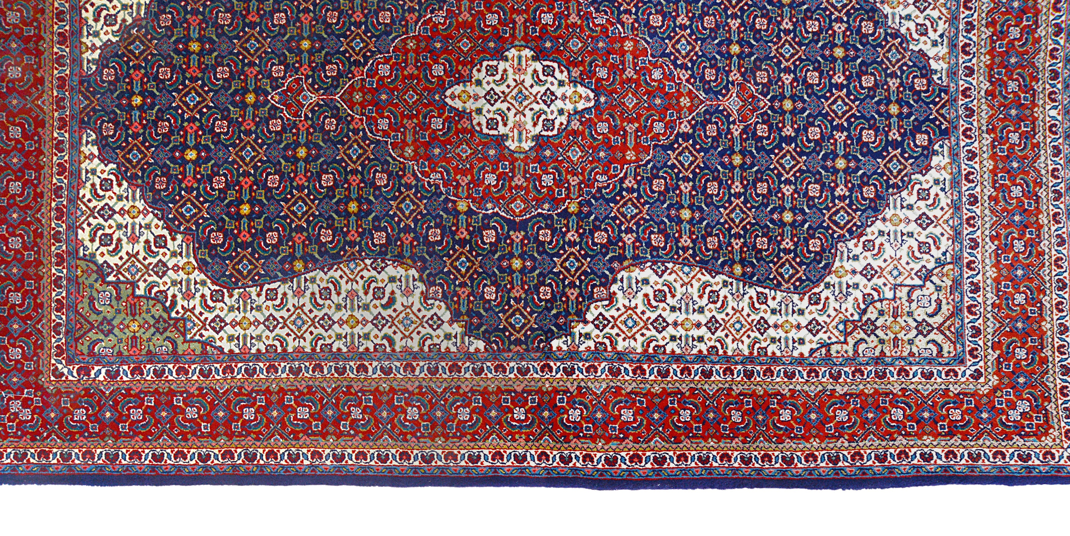 Close-up details of vintage Persian Sarouk rug showing wool texture, motifs, and natural patina