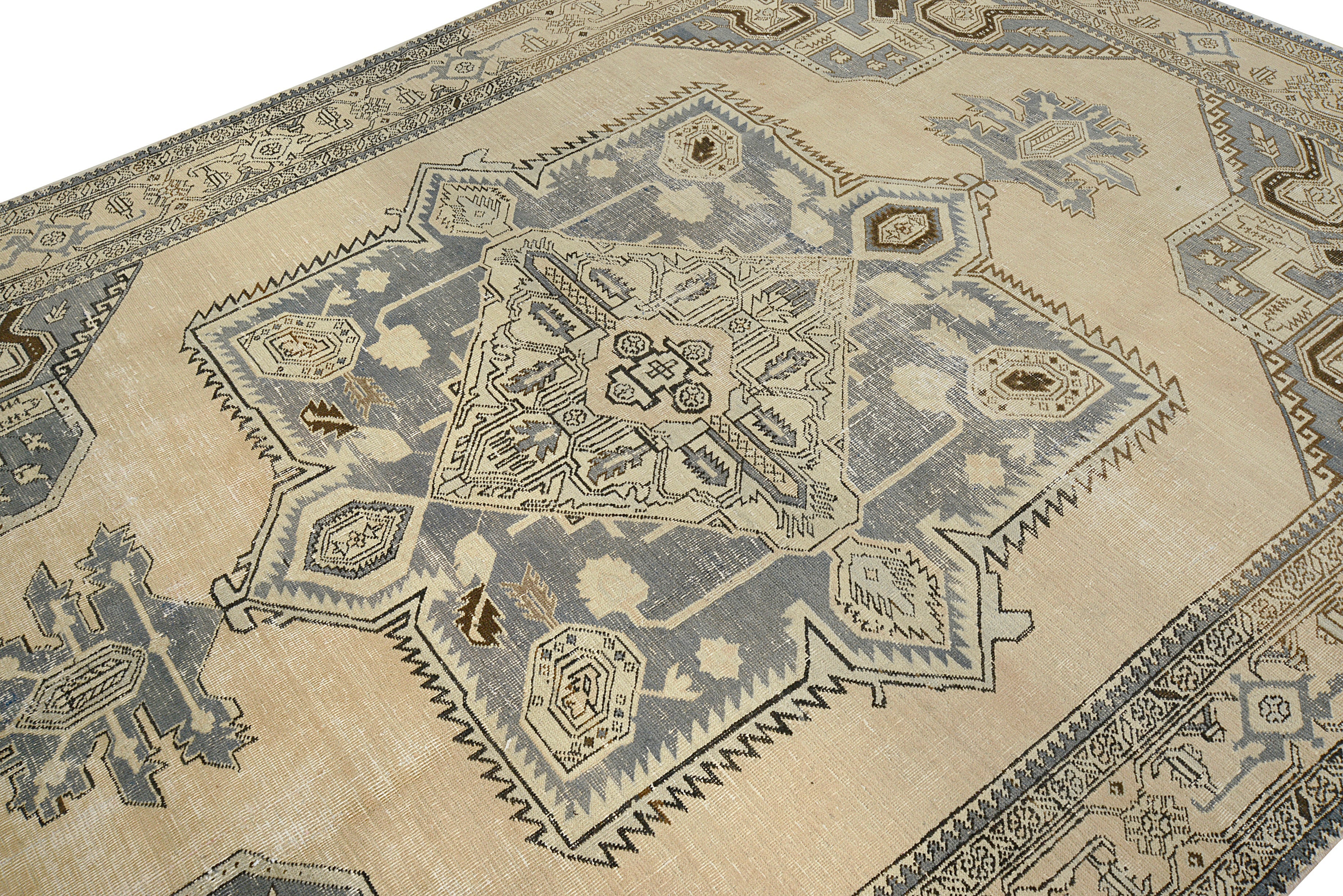 Close-up details of vintage Persian Tabriz carpet showing wool texture, motifs, and natural patina