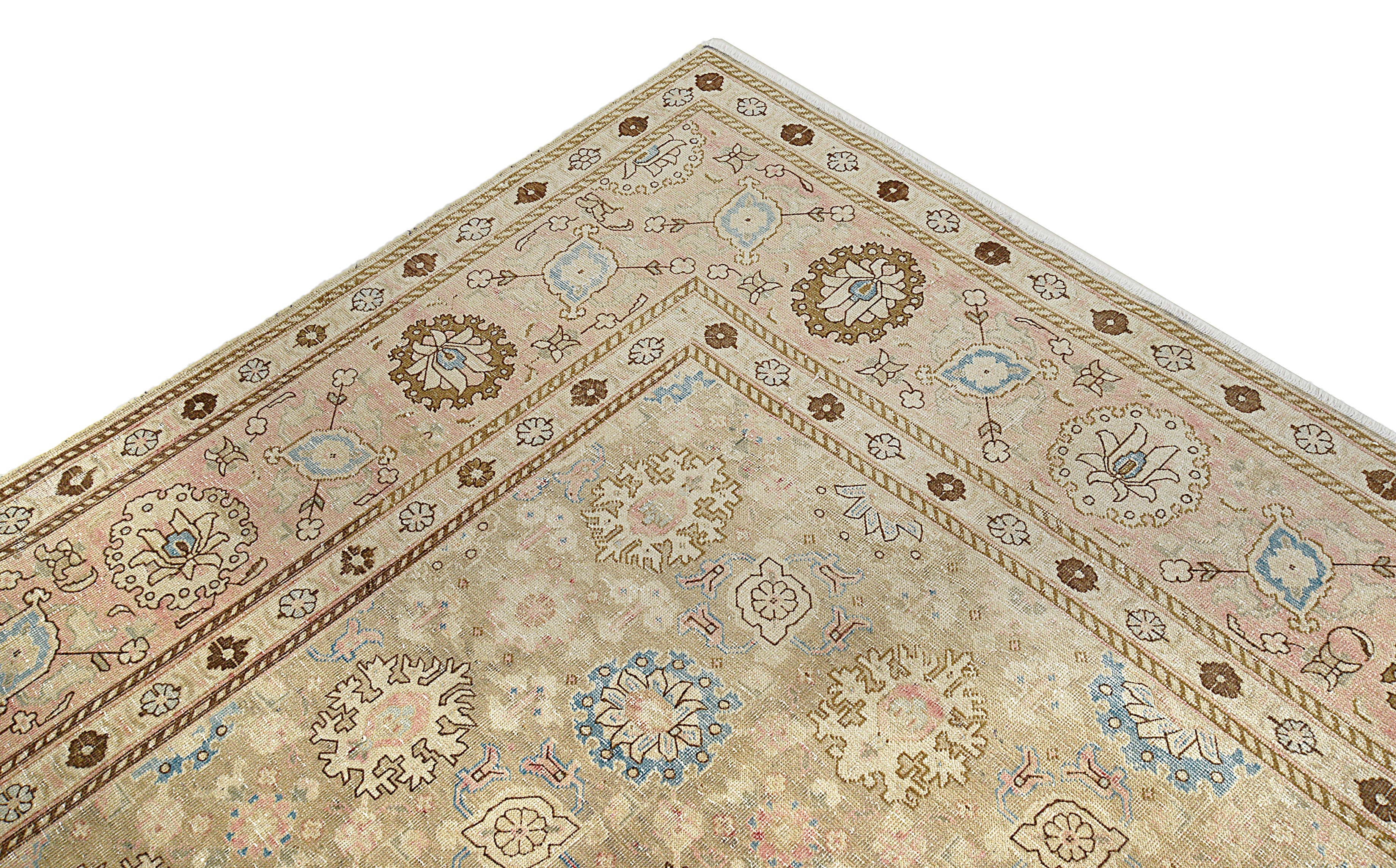 Close-up details of vintage Persian Tabriz carpet showing wool texture, borders, and natural patina