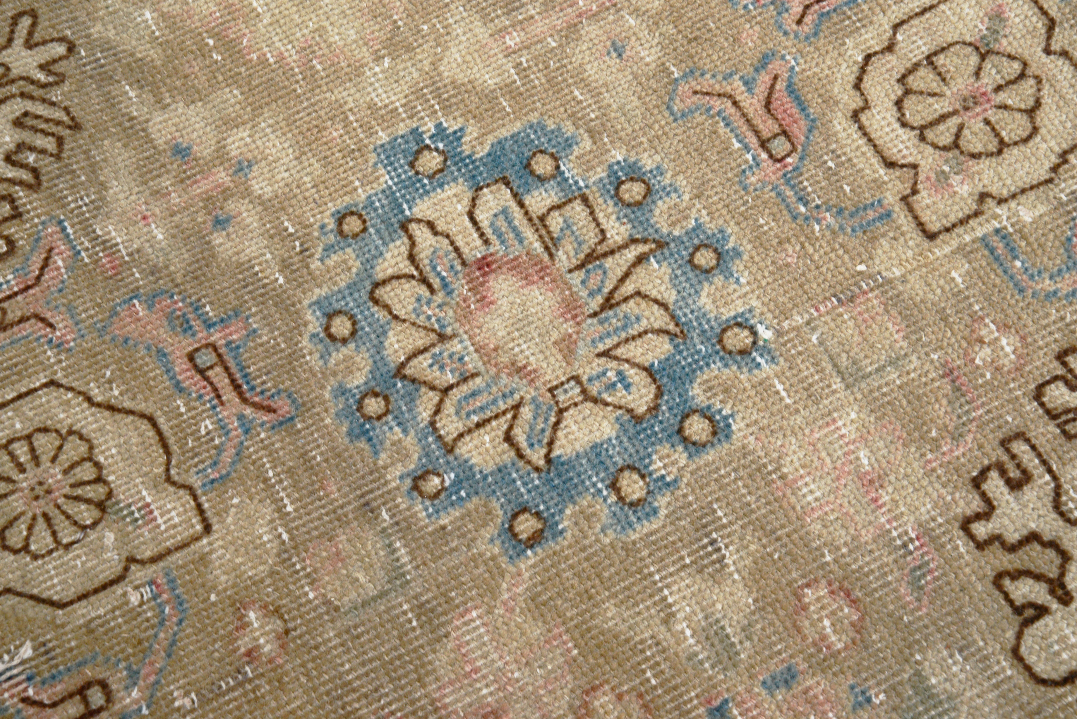 Close-up details of vintage Persian Tabriz carpet showing wool texture, borders, and natural patina