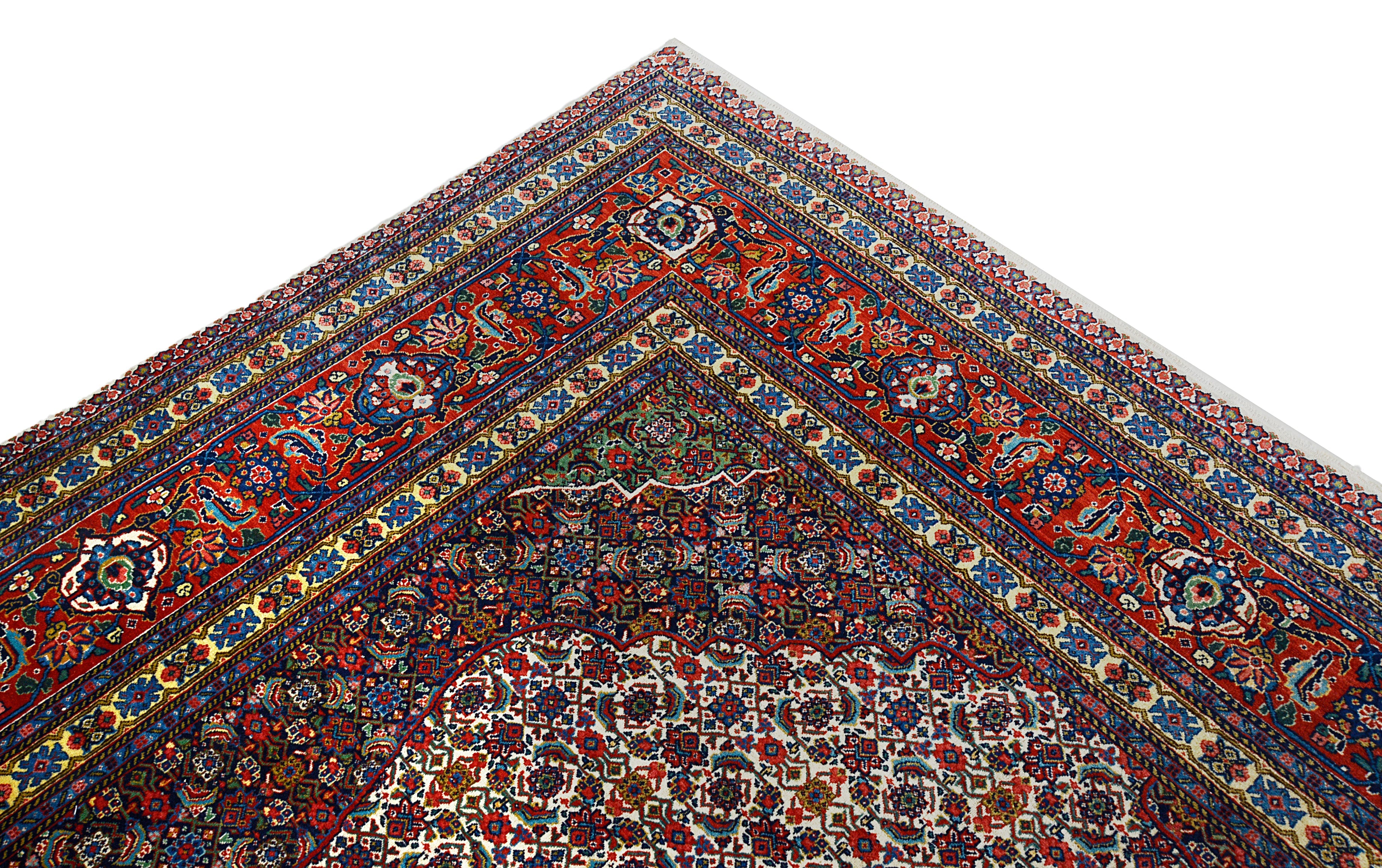 Close-up details of vintage Persian Tabriz carpet showing fine wool texture, motifs, and natural patina