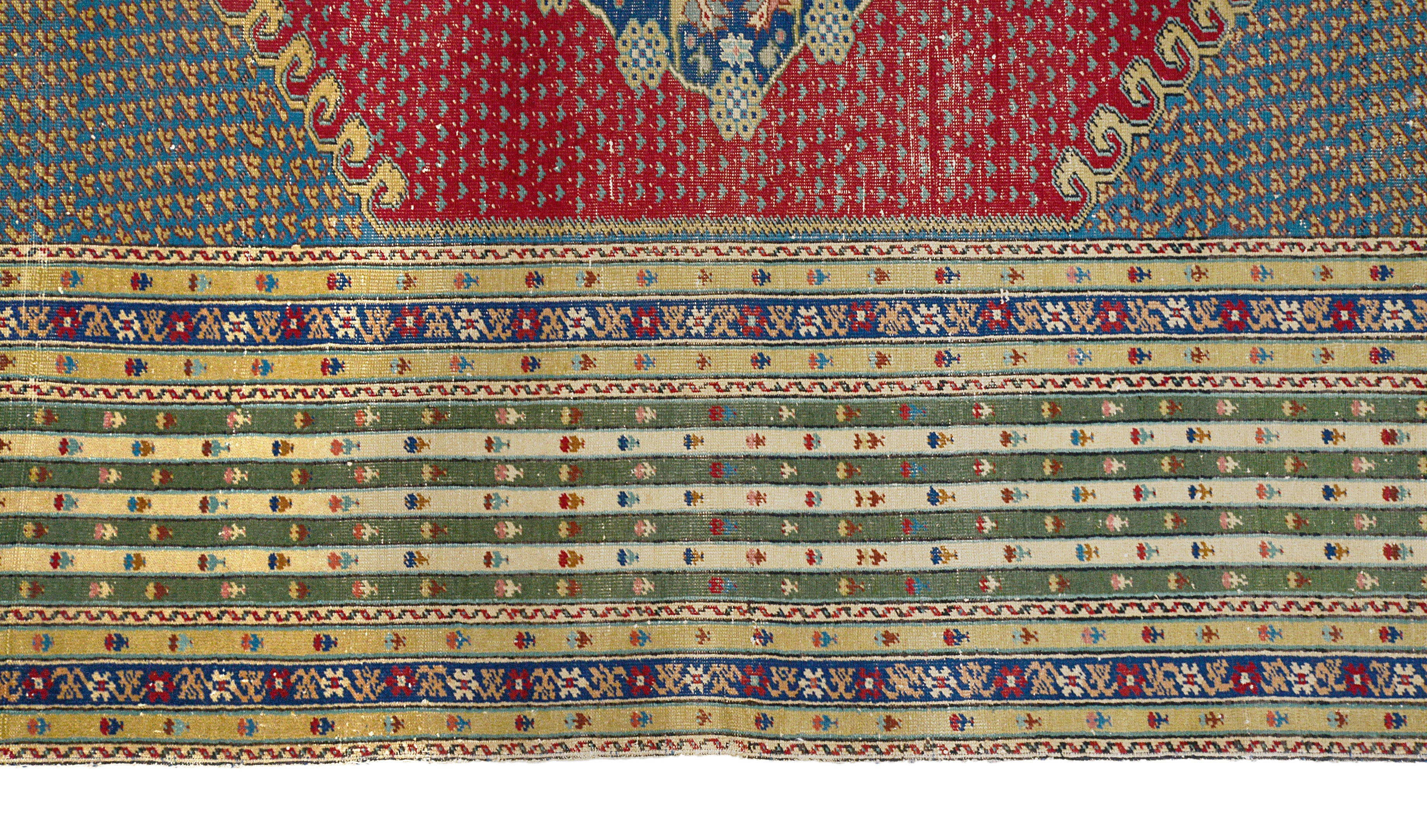 Close-up details of antique Turkish rug showing wool texture, motifs, and natural patina