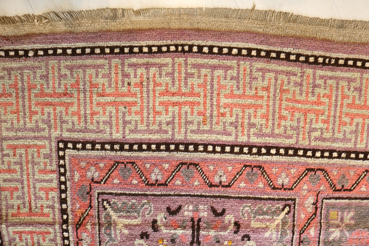 Detailed corner section featuring floral motifs and layered borders