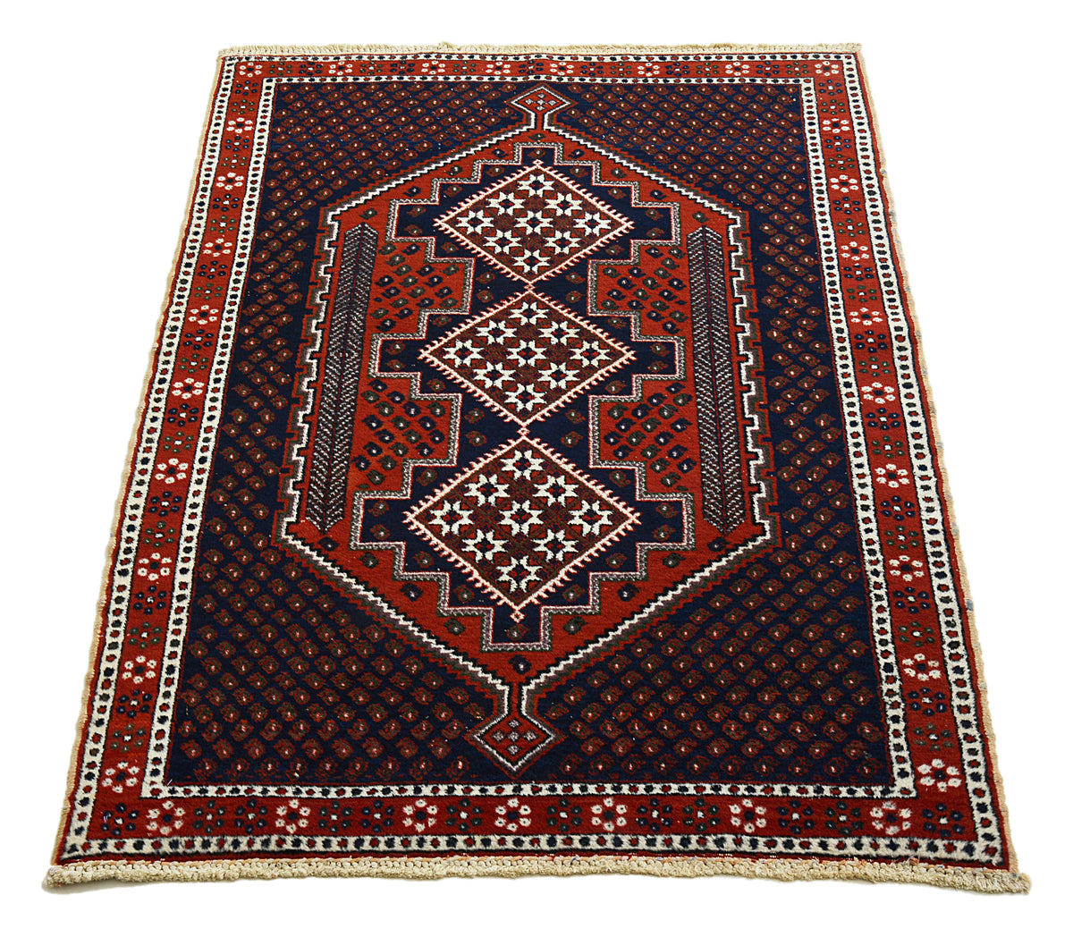 Full view of antique Afshar rug with central geometric medallions in indigo, red and ivory